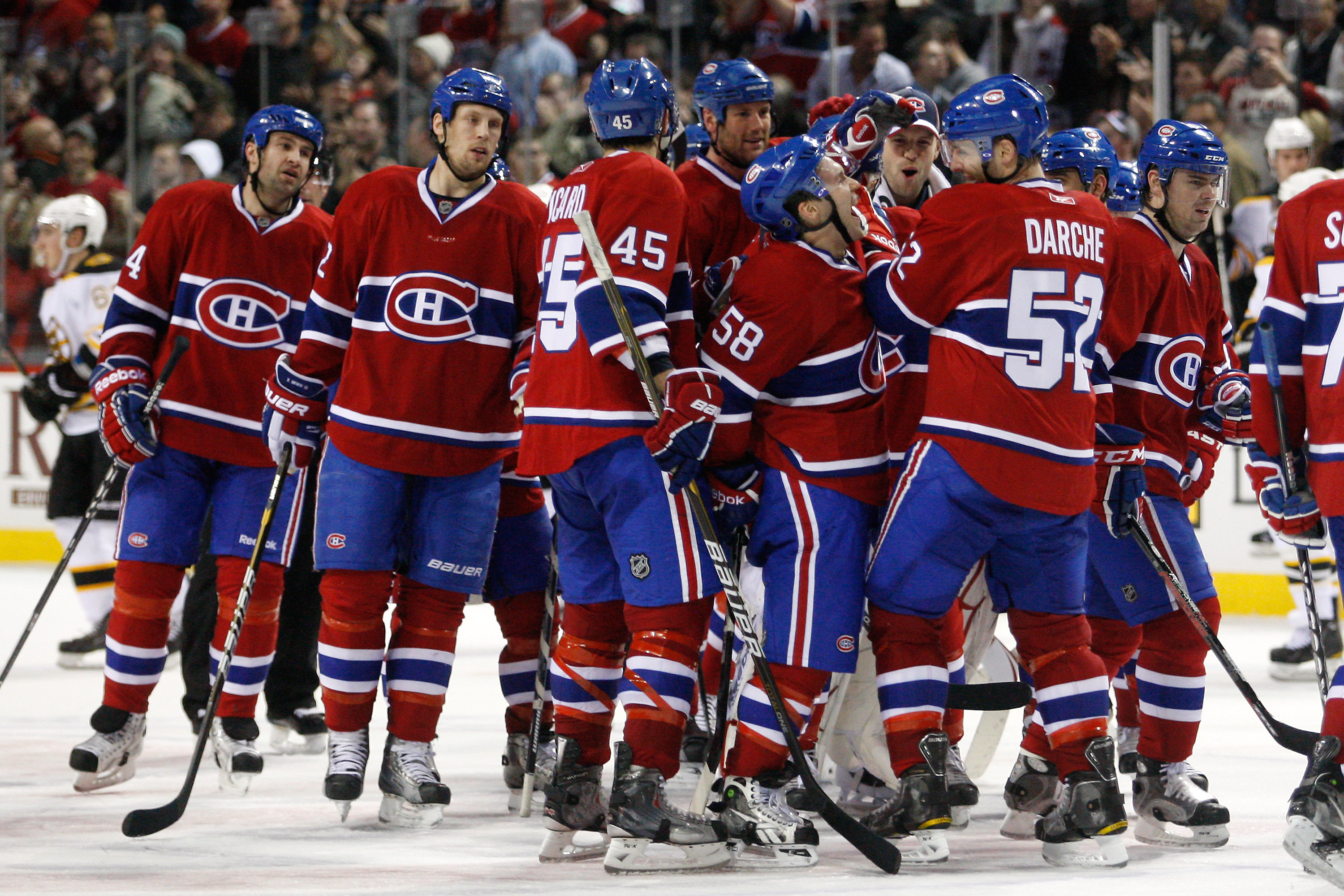 MONTREAL, CANADA - JANUARY 8:  Members of the Montreal Canadiens celebrate after beating the Boston Bruins in overtime in the NHL game at the Bell Centre on January 8, 2011 in Montreal, Quebec, Canada.  The Canadiens defeated the Bruins 3-2 in overtime.