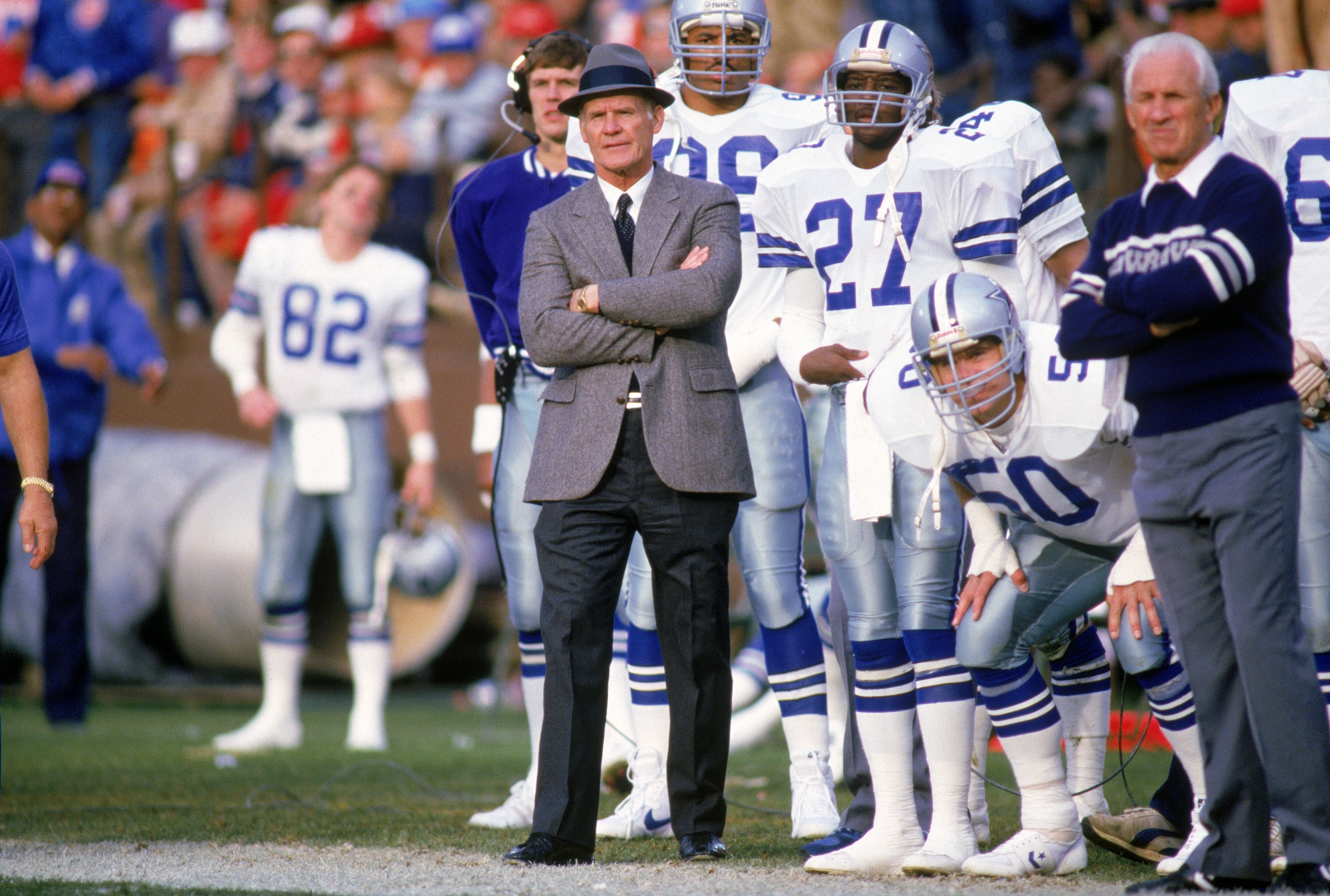 1988:  Head coach Tom Landry of the Dallas Cowboys watches from the sideline during a game in the 1988 season.  Tom Landry coached the Cowboys from 1960 to 1988, leading them to two Super Bowl victories.  (Photo by Otto Greule Jr./Getty Images)