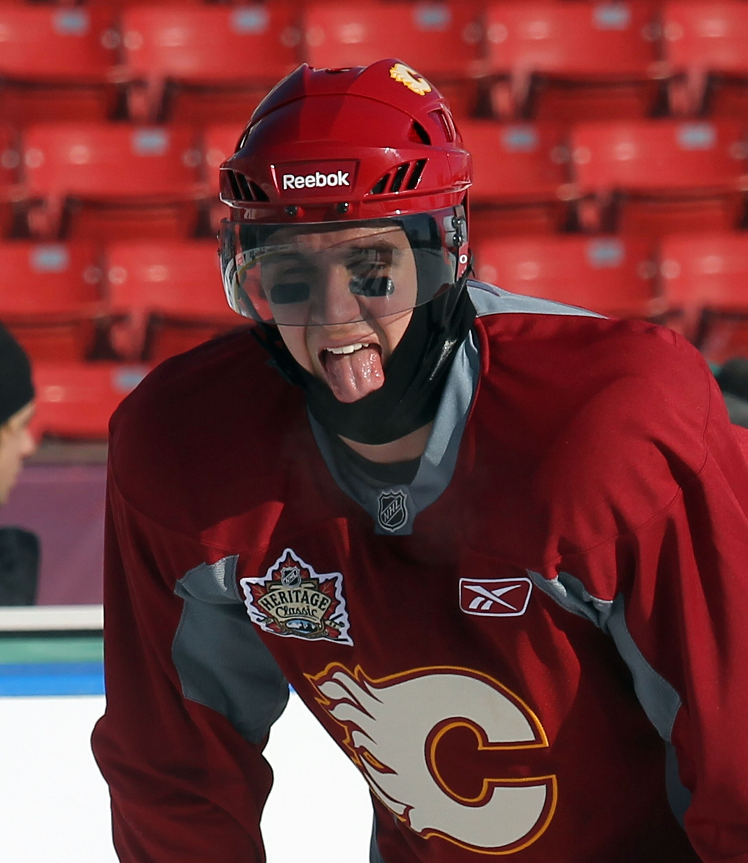 CALGARY, AB - FEBRUARY 19:  Mikael Backlund #11 of the Calgary Flames copes with the weather during the practice session the day before the 2011 NHL Heritage Classic at McMahon Stadium on February 19, 2011 in Calgary, Canada.  (Photo by Andre Ringuette/Ge