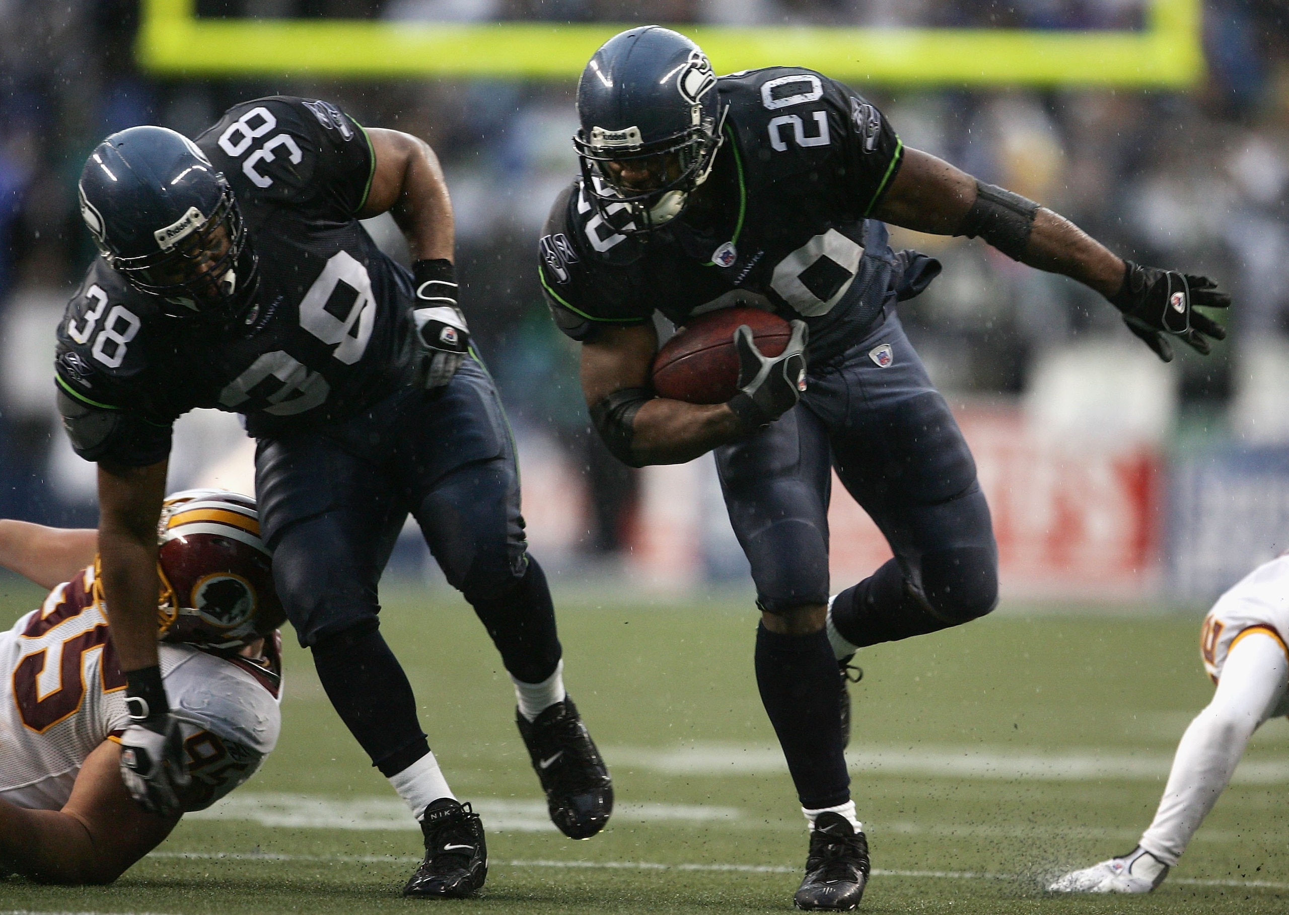 SEATTLE - JANUARY 14:  Runningback Maurice Morris #20 of the Seattle Seahawks carries the ball alongside Mack Strong #38 during the NFC Divisional Playoff game against the Washington Redskins on January 14, 2006 at Qwest Field in Seattle, Washington.  (Ph