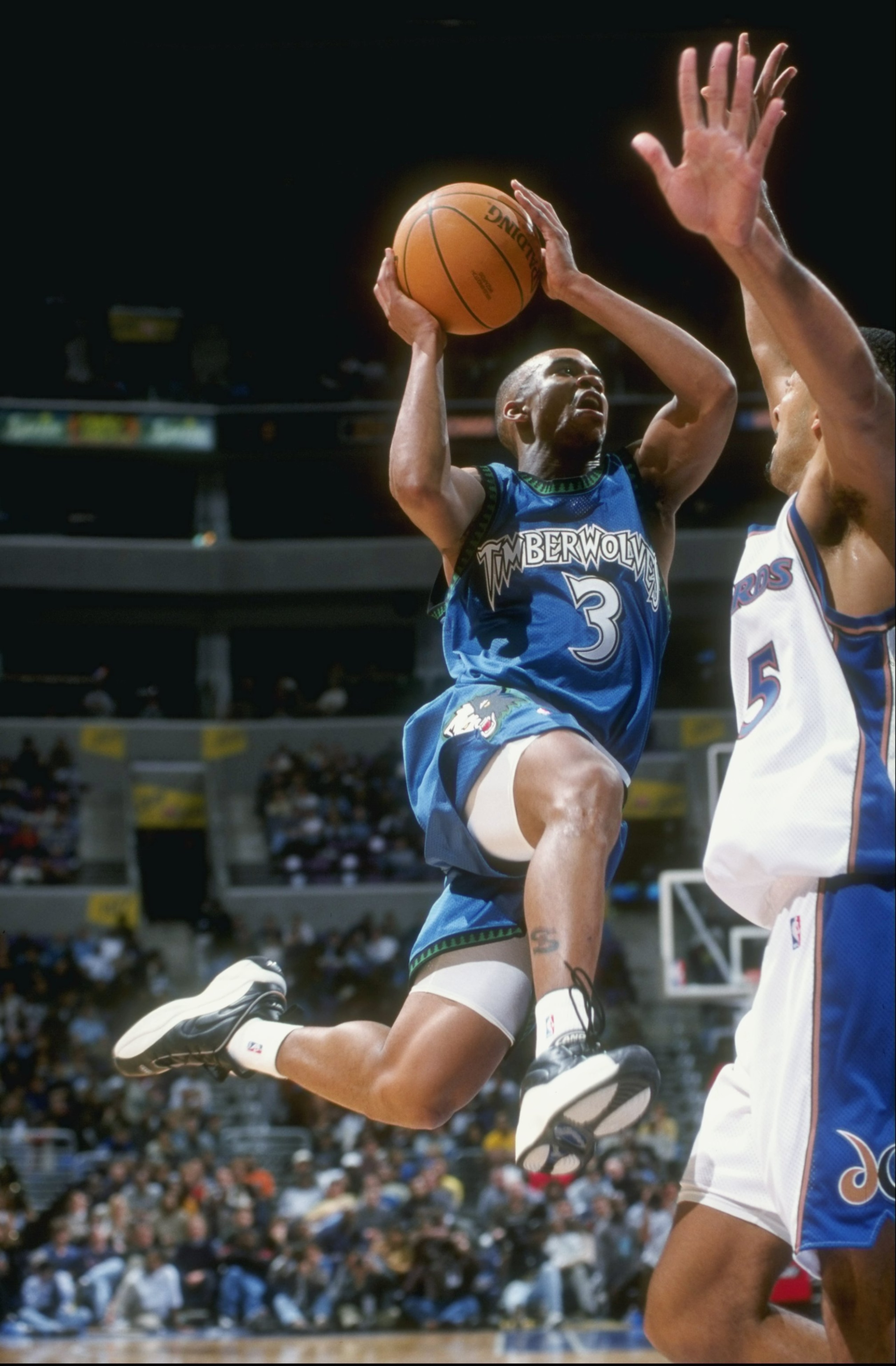 6 Dec 1997:  Guard Stephon Marbury of the Minnesota Timberwolves drives towards forward Juwan Howard of the Washington Wizards during a game at the MCI Center in Washington D.C.  The Wizards won the game 114-103. Mandatory Credit: Doug Pensinger  /Allspor