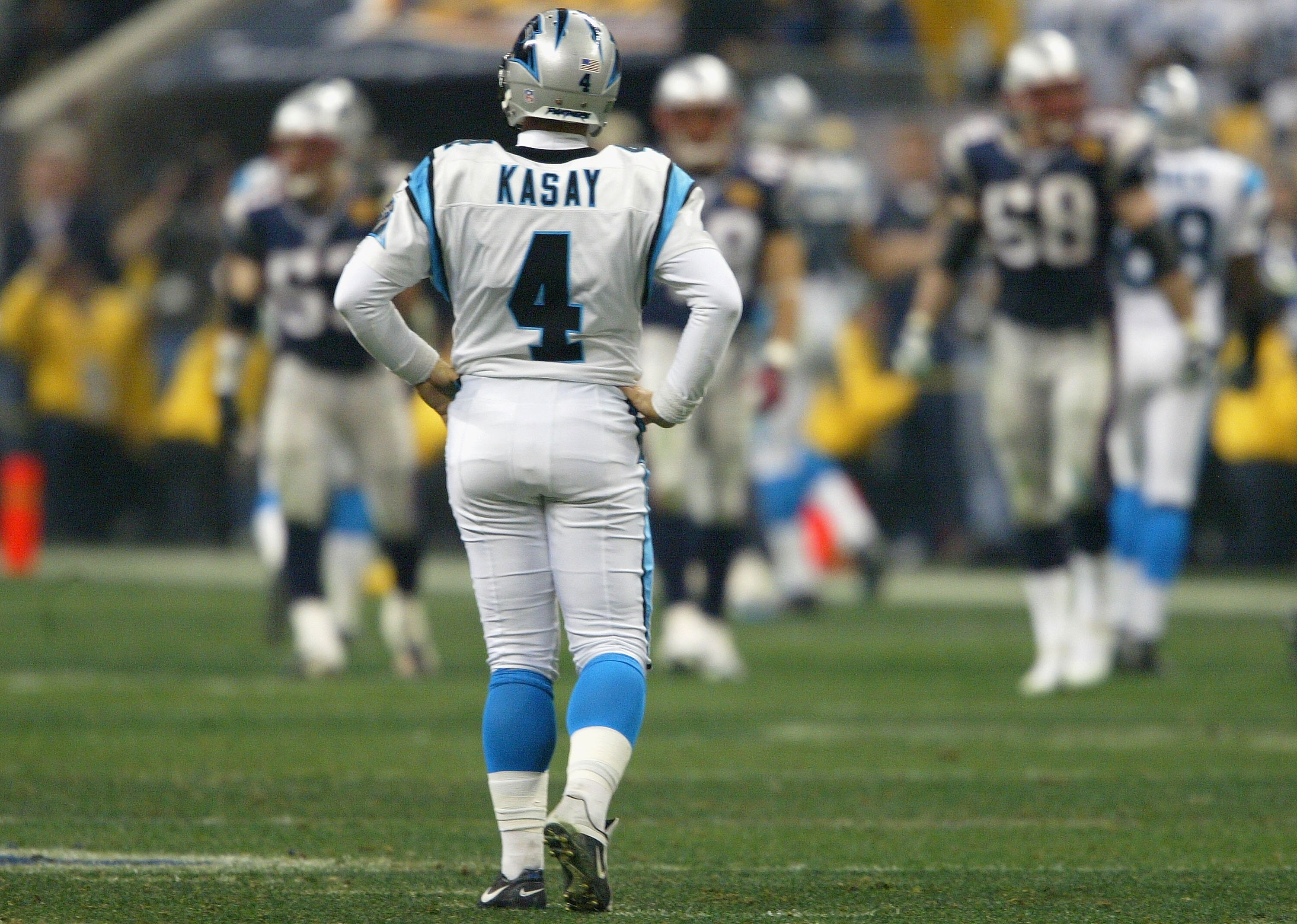 HOUSTON, TX - FEBRUARY 1:  John Kasay #4 of the Carolina Panthers reacts after kicking the kick off out of bounds in the fourth quarter of Super Bowl XXXVIII at Reliant Stadium on February 1, 2004 in Houston, Texas. The Patriots defeated the Panthers 32-2
