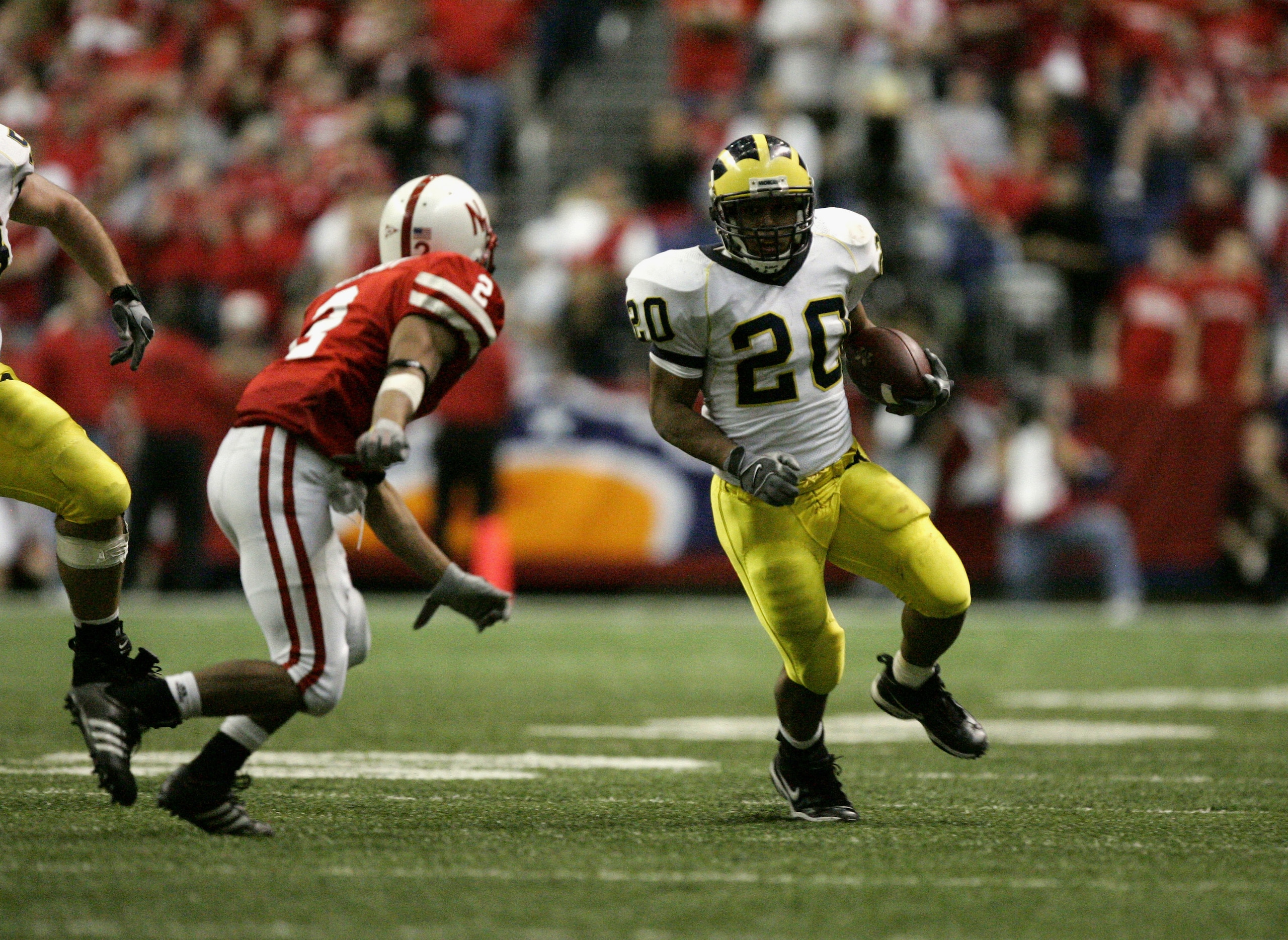 SAN ANTONIO - DECEMBER 28:  Running back Mike Hart #20 of the Michigan Wolverines carries the ball against the Nebraska Cornhuskers during the MasterCard Alamo Bowl on December 28, 2005 at the Alamodome in San Antonio, Texas.  The Huskers won 32-28.  (Pho