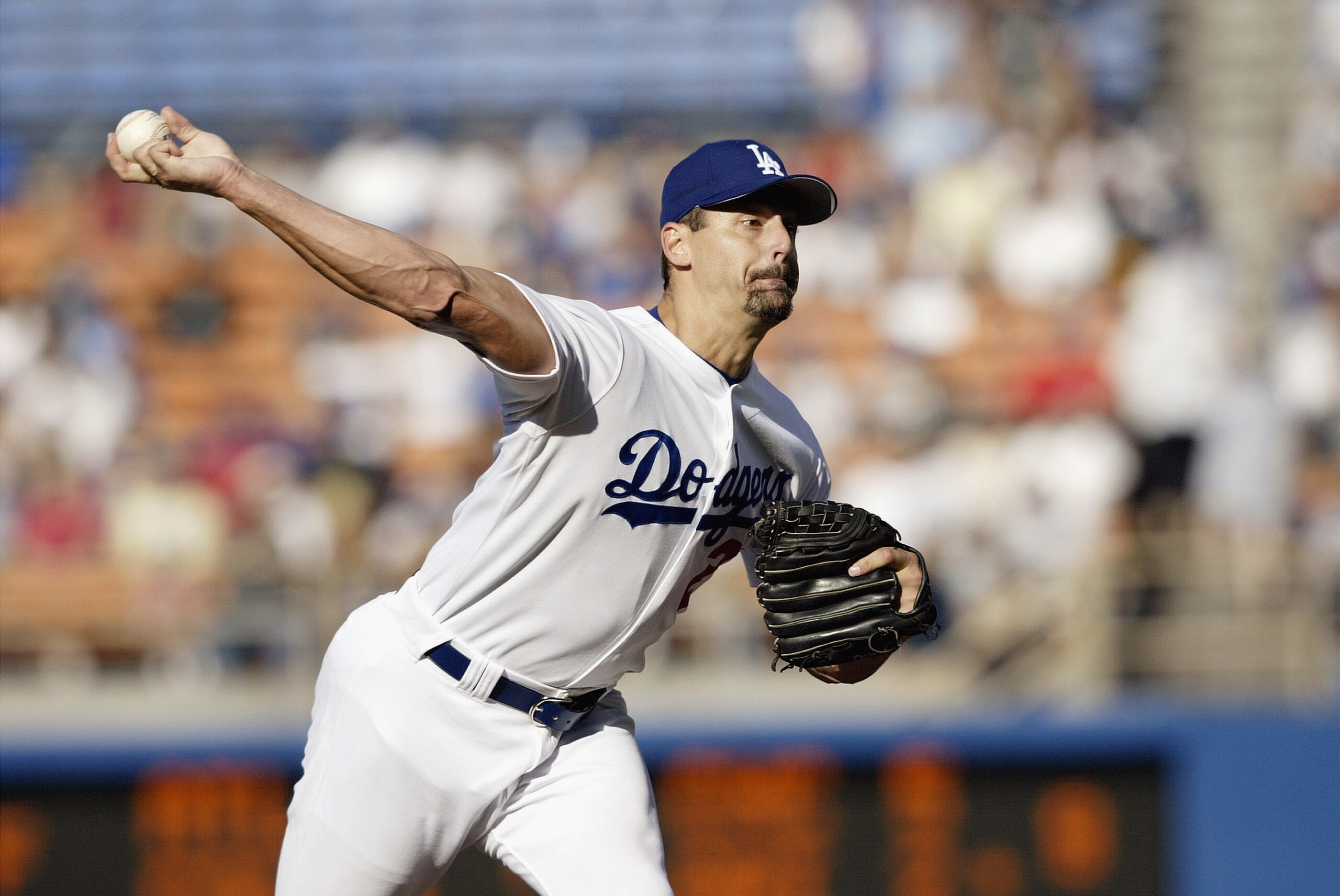 LOS ANGELES - AUGUST 24: Starting pitcher Kevin Brown #27 of the Los Angeles Dodgers delivers a pitch during the National League game against the New York Mets at Dodgers Stadium on August 24, 2003 in Los Angeles, California. The Mets defeated the Dodger LOS ANGELES - AUGUST 24: Starting pitcher Kevin Brown #27 of the Los Angeles Dodgers delivers a pitch during the National League game against the New York Mets at Dodgers Stadium on August 24, 2003 in Los Angeles, California. The Mets defeated the Dodger