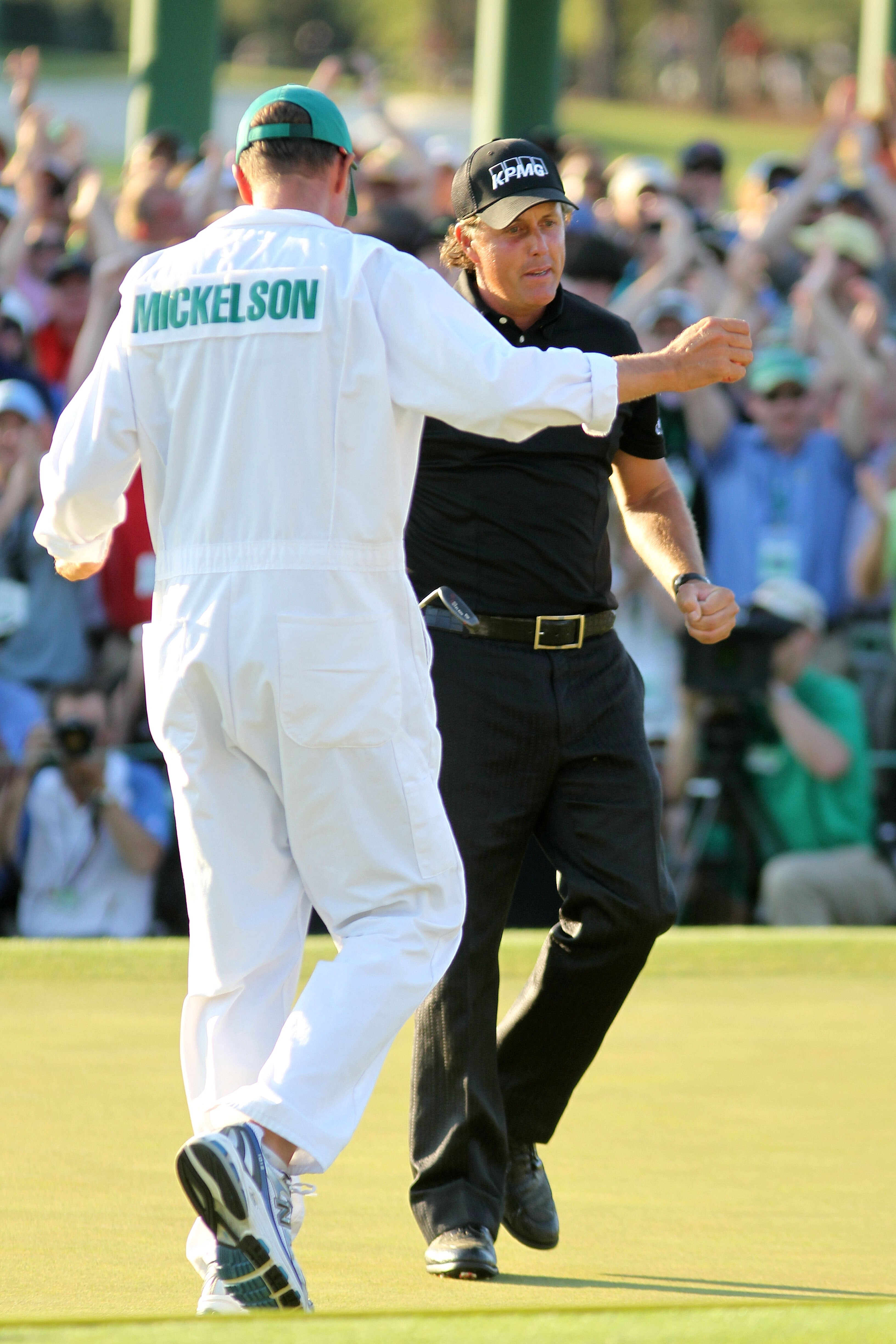 AUGUSTA, GA - APRIL 11:  Phil Mickelson hugs his caddie Jim Mackay after his three-stroke victory after winning the 2010 Masters Tournament at Augusta National Golf Club on April 11, 2010 in Augusta, Georgia.  (Photo by Jamie Squire/Getty Images)