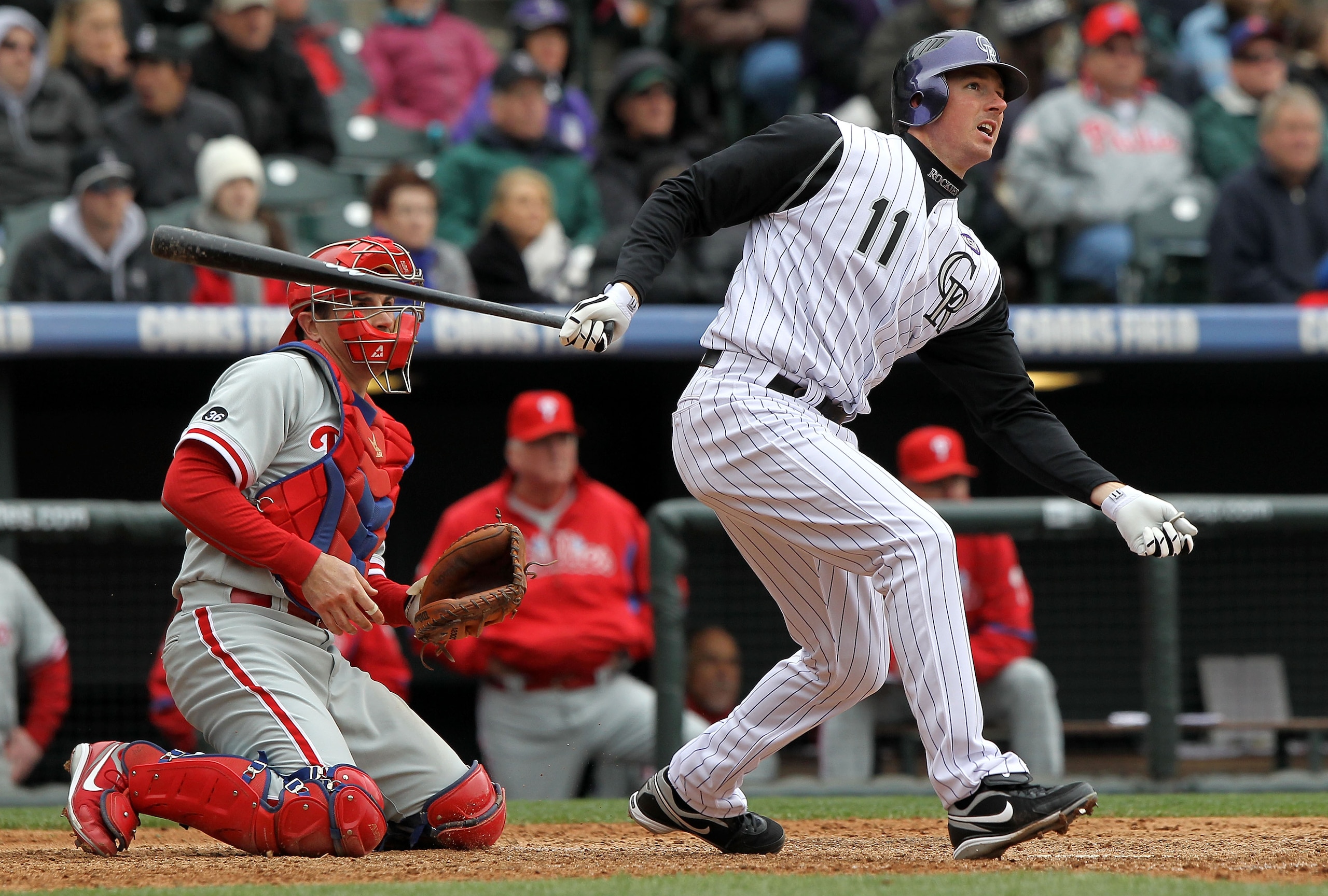 DENVER - MAY 12: Brad Hawpe #11 of the Colorado Rockies follows through on his two RBI triple to tie the score 3-3 against the Philadelphia Phillies in the seventh inning at Coors Field on May 12, 2010 in Denver, Colorado. The Rockies defeated the Philli DENVER - MAY 12: Brad Hawpe #11 of the Colorado Rockies follows through on his two RBI triple to tie the score 3-3 against the Philadelphia Phillies in the seventh inning at Coors Field on May 12, 2010 in Denver, Colorado. The Rockies defeated the Philli