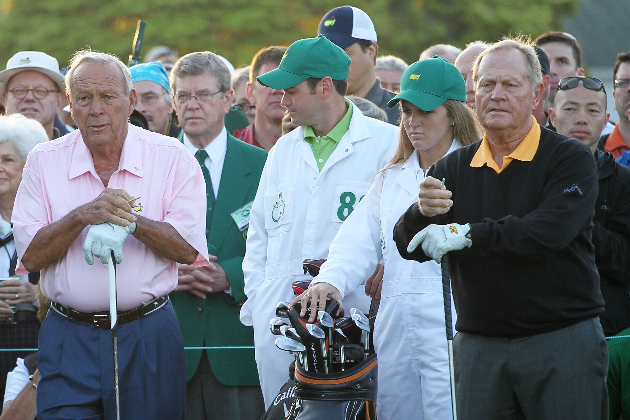 AUGUSTA, GA - APRIL 08:  Honorary starters Jack Nicklaus (R) and Arnold Palmer (L) look on while alongside their caddies on the first tee during the first round of the 2010 Masters Tournament at Augusta National Golf Club on April 8, 2010 in Augusta, Geor