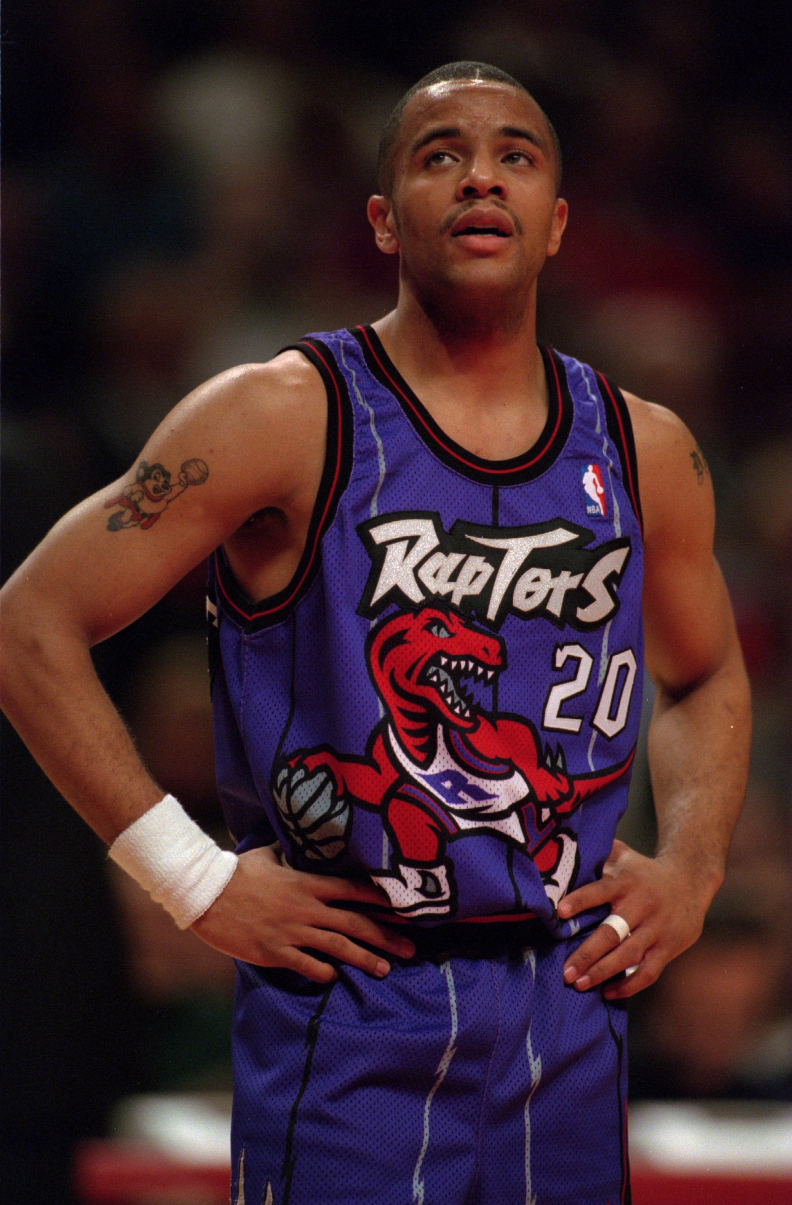 22 Dec 1995:  Point guard Damon Stoudamire of the Toronto Raptors relaxes for a moment during a break in the action of  the Raptors 113-104 loss to the Bulls at the United Center in Chicago, Illinois.    Mandatory Credit: Jonathan Daniel/ALLSPORT