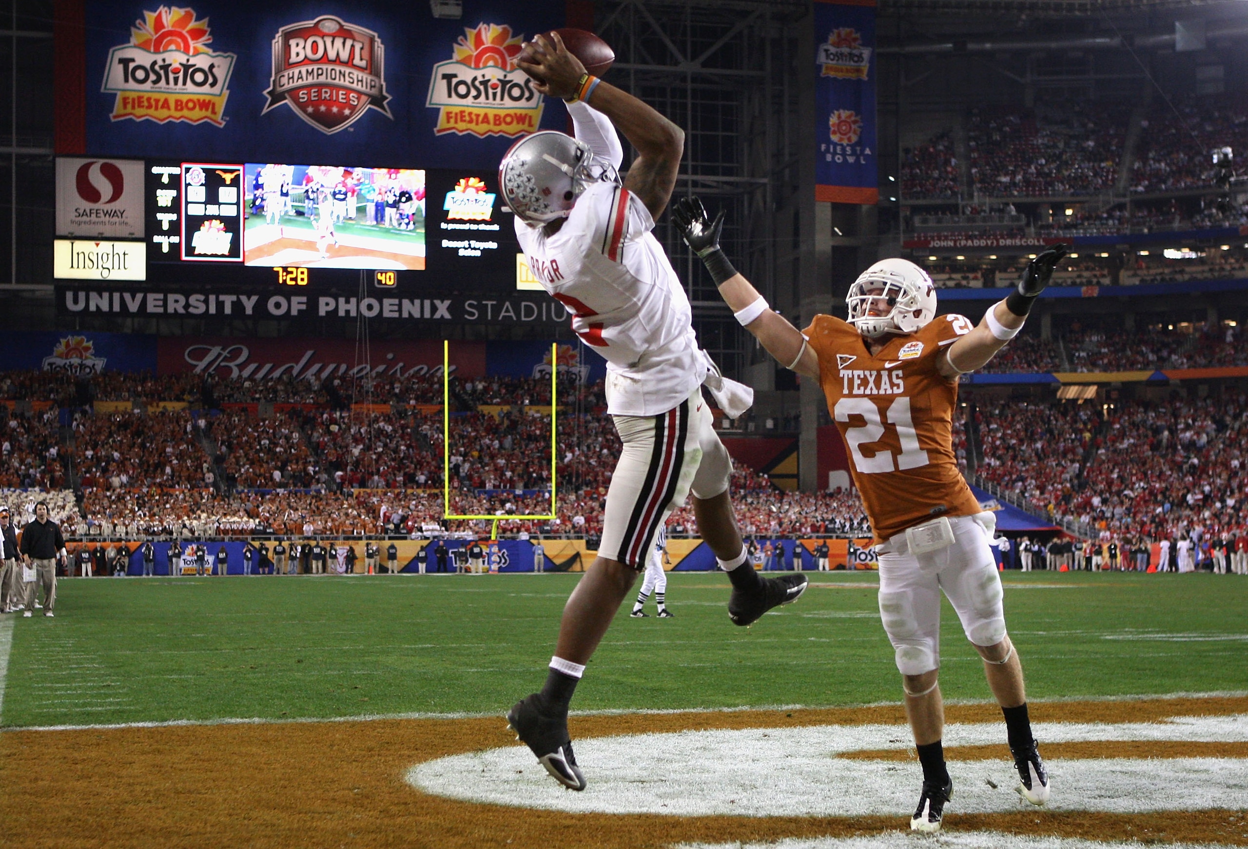 GLENDALE, AZ - JANUARY 05:  Terrelle Pryor #2 of the Ohio State Buckeyes makes a leaping 5 yard touchdown reception over Blake Gideon #21 of the Texas Longhorns during the fourth quarter of the Tostitos Fiesta Bowl Game on January 5, 2009 at University of