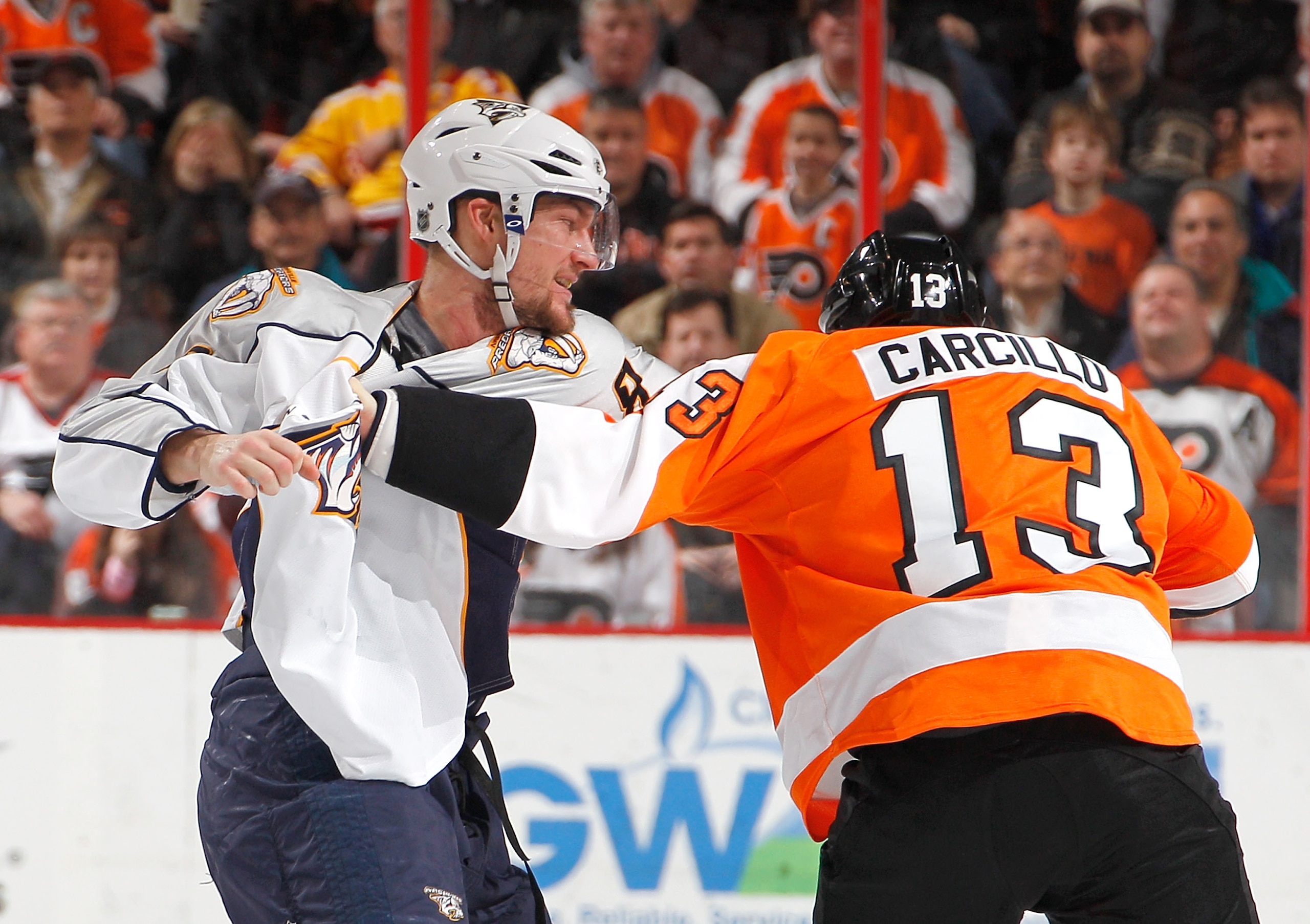 PHILADELPHIA, PA - FEBRUARY 03:  Alexander Sulzer #52 of the Nashville Predators fights with Daniel Carcillo #13 of the Philadelphia Flyers during the second period of an NHL hockey game at the Wells Fargo Center on February 3, 2011 in Philadelphia, Penns