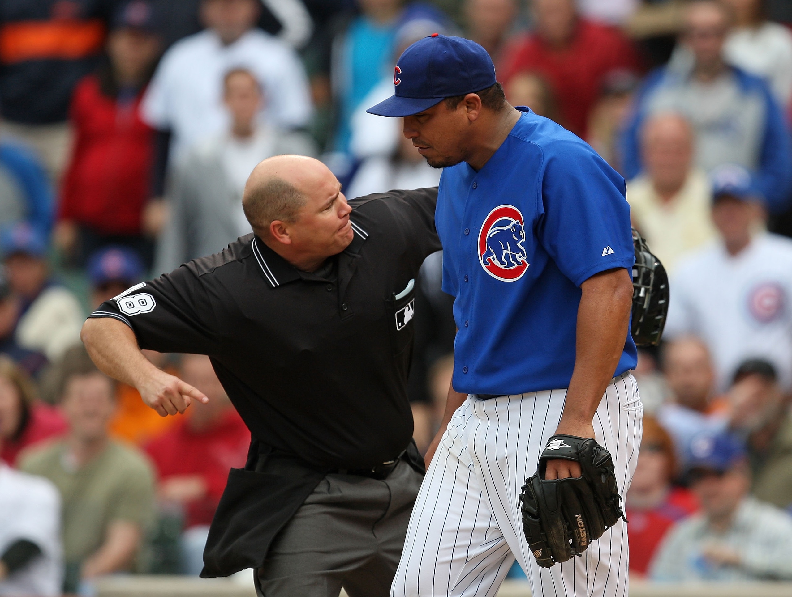 CHICAGO - MAY 27: Home plate umpire Mark Carlson #48 ejects starting pitcher Carlos Zambrano #38 of the Chicago Cubs after an arguement over a play at the plate between Zambrano and Nyjer Morgan of the Pittsburgh Pirates on May 27, 2009 at Wrigley Field i