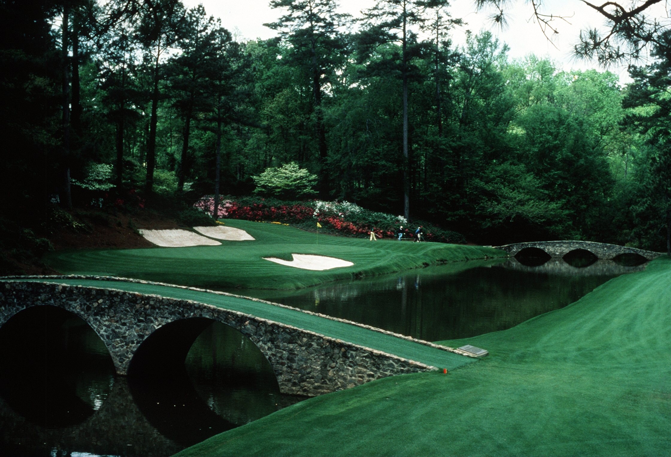 A SCENIC VIEW OF THE INFAMOUS AMEN CORNER OF THE PAR 3 12TH HOLE DURING THE 1992 MASTERS TOURNAMENT AT THE AUGUSTA NATIONAL GOLF COURSE IN AUGUSTA, GEORGIA.