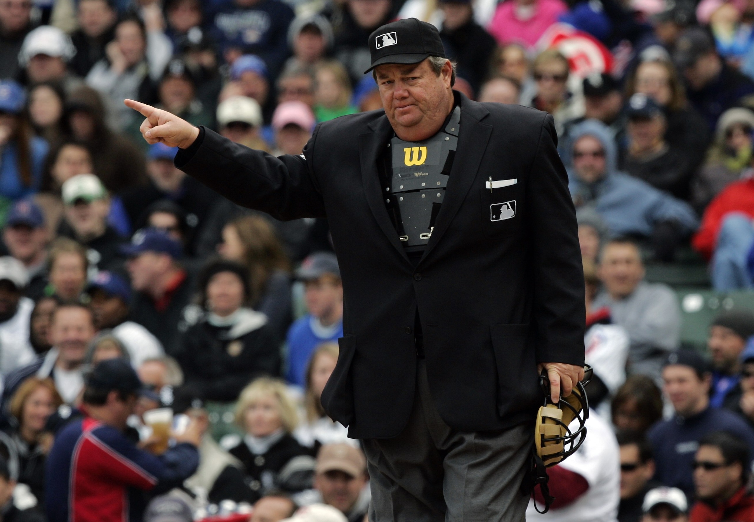 CHICAGO - MAY 20:  Home plate umpire Joe West points during the Chicago White Sox game against the Chicago Cubs during interleague play on May 20, 2007 at Wrigley Field in Chicago, Illinois. The White Sox won 10-6. (Photo by Brian Bahr/Getty Images)