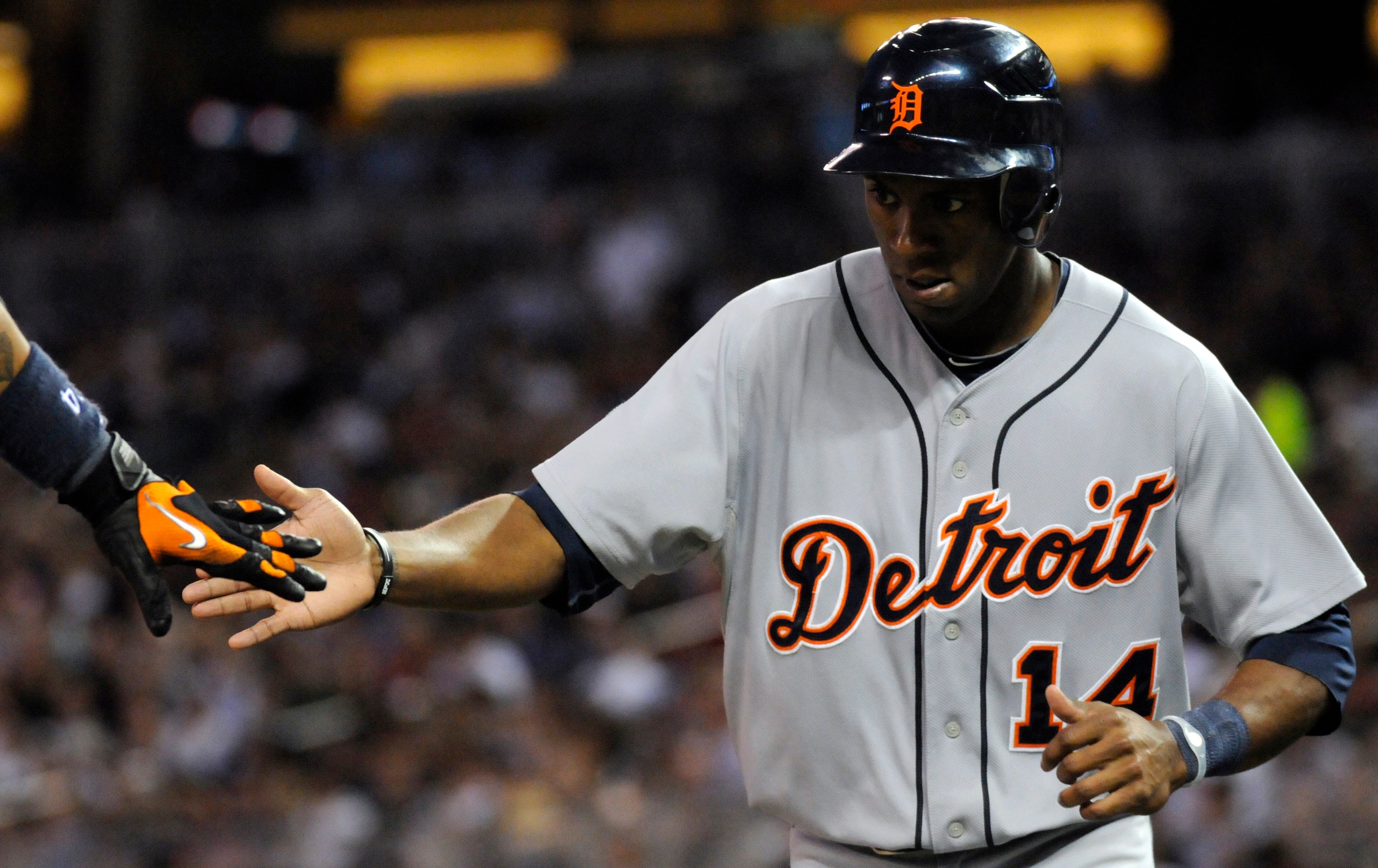 MINNEAPOLIS, MN - JUNE 28: Austin Jackson #14 of the Detroit Tigers celebrates scoring in the seventh inning against the Minnesota Twins during their game on June 28, 2010 at Target Field in Minneapolis, Minnesota. Tigers defeated the Twins 7-5. (Photo by MINNEAPOLIS, MN - JUNE 28: Austin Jackson #14 of the Detroit Tigers celebrates scoring in the seventh inning against the Minnesota Twins during their game on June 28, 2010 at Target Field in Minneapolis, Minnesota. Tigers defeated the Twins 7-5. (Photo by