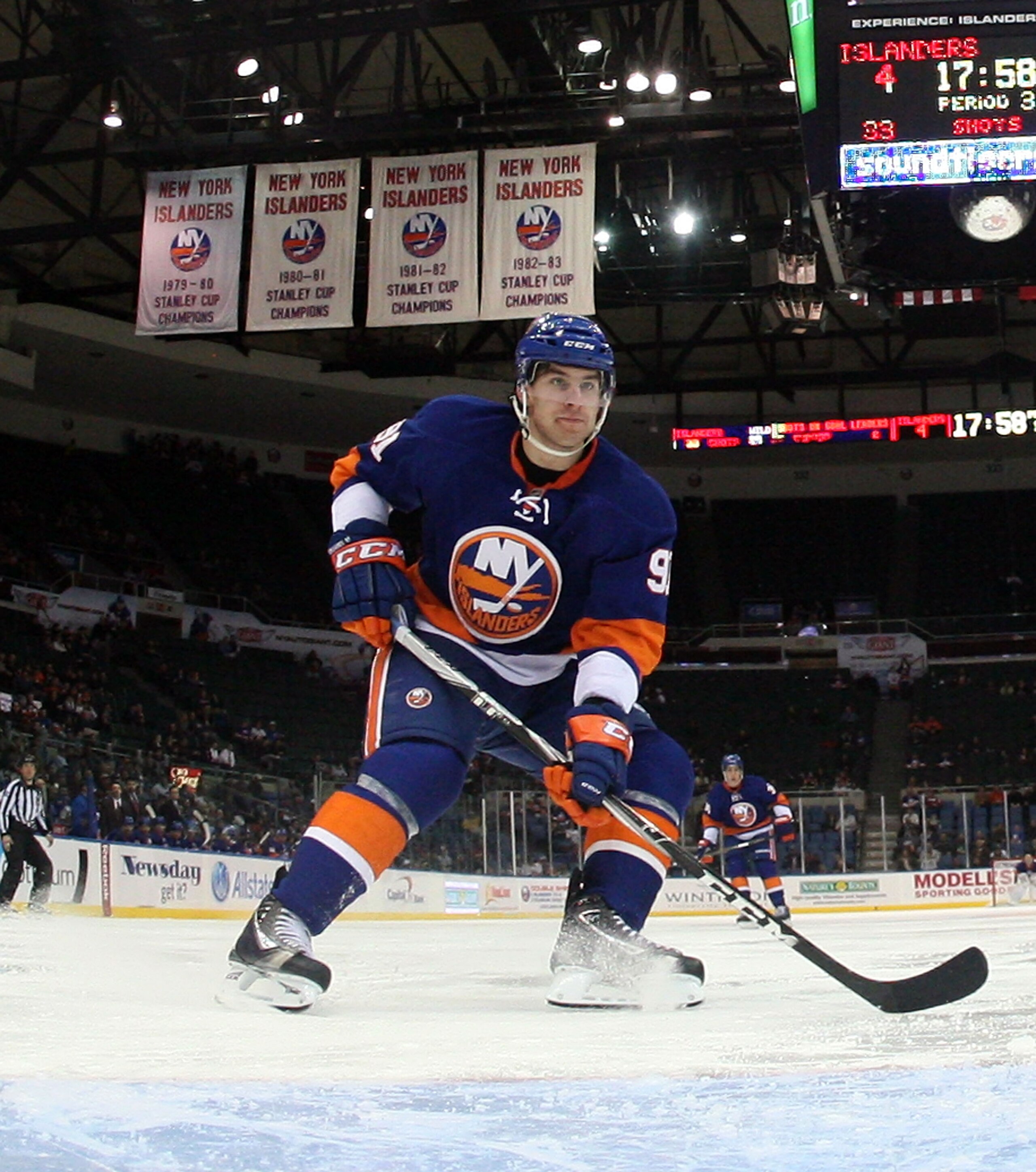 UNIONDALE, NY - MARCH 02:  John Tavares #91 of the New York Islanders skates against the Minnesota Wild at the Nassau Coliseum on March 2, 2011 in Uniondale, New York. The Islanders defeated the Wild 4-1.  (Photo by Bruce Bennett/Getty Images)