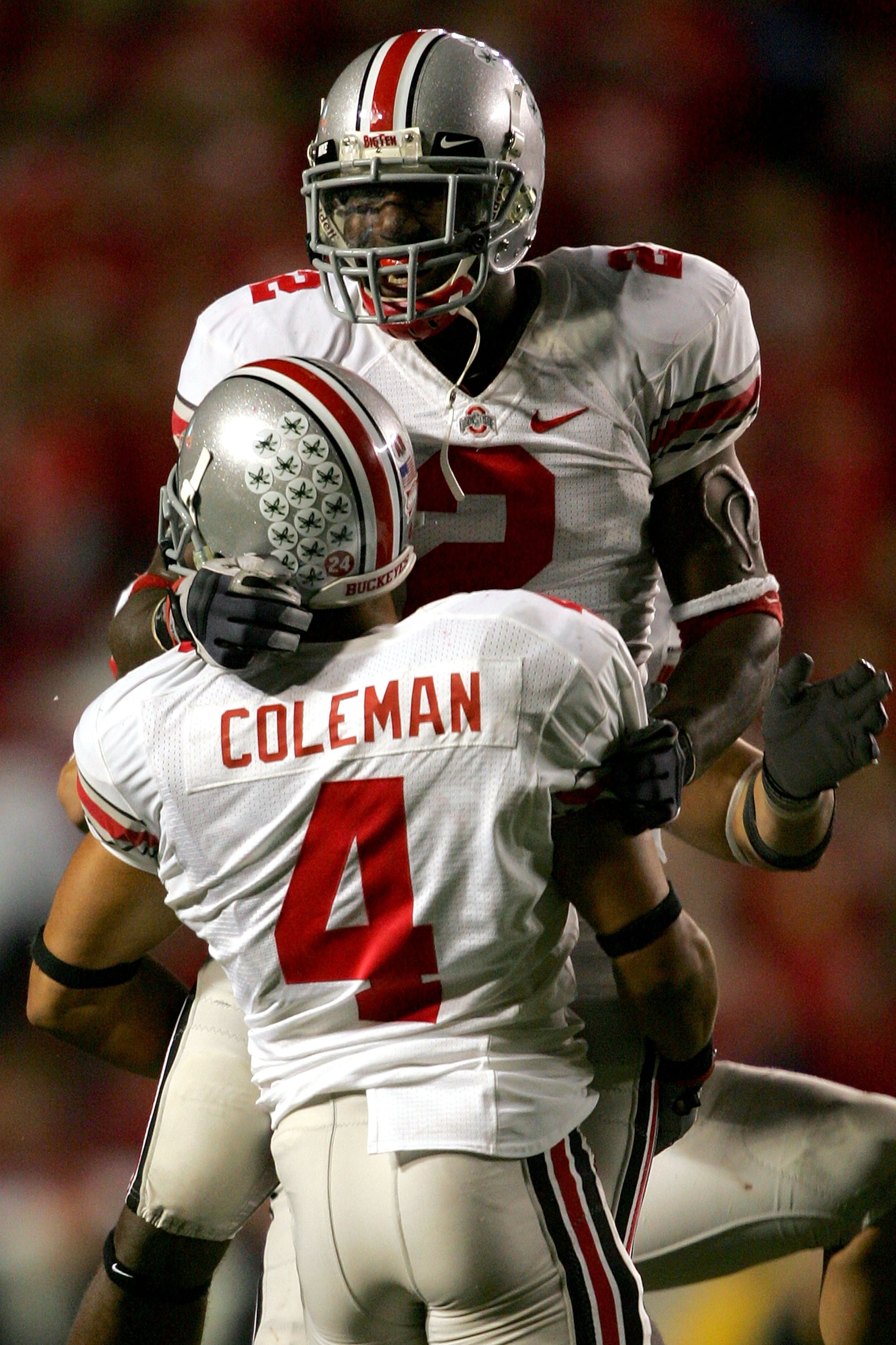 MADISON, WI - OCTOBER 04:  Malcolm Jenkins #2 of the Ohio State Buckeyes celebrates in the arms of Kurt Coleman #4 after intercepting a pass against the Wisconsin Badgers on their final possession of the fourth quarter at Camp Randall Stadium  October 4,