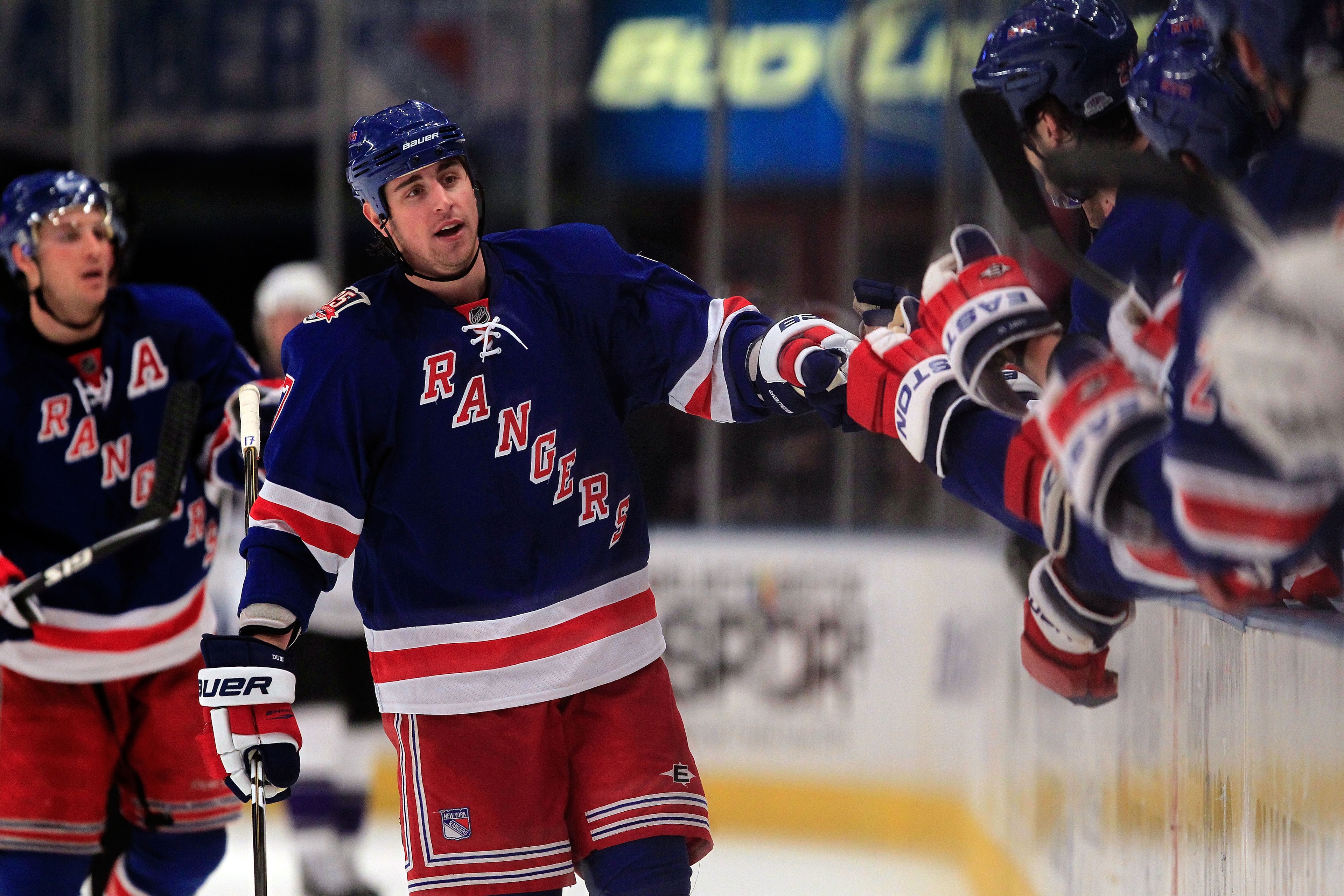 NEW YORK, NY - FEBRUARY 17:  Brandon Dubinsky #17 of the New York Rangers is congratulated by his teammates for his goal in the third period against the Los Angeles Kings on February 17, 2011 in New York City. The Rangers defeated the Kings 4-3 after a sh