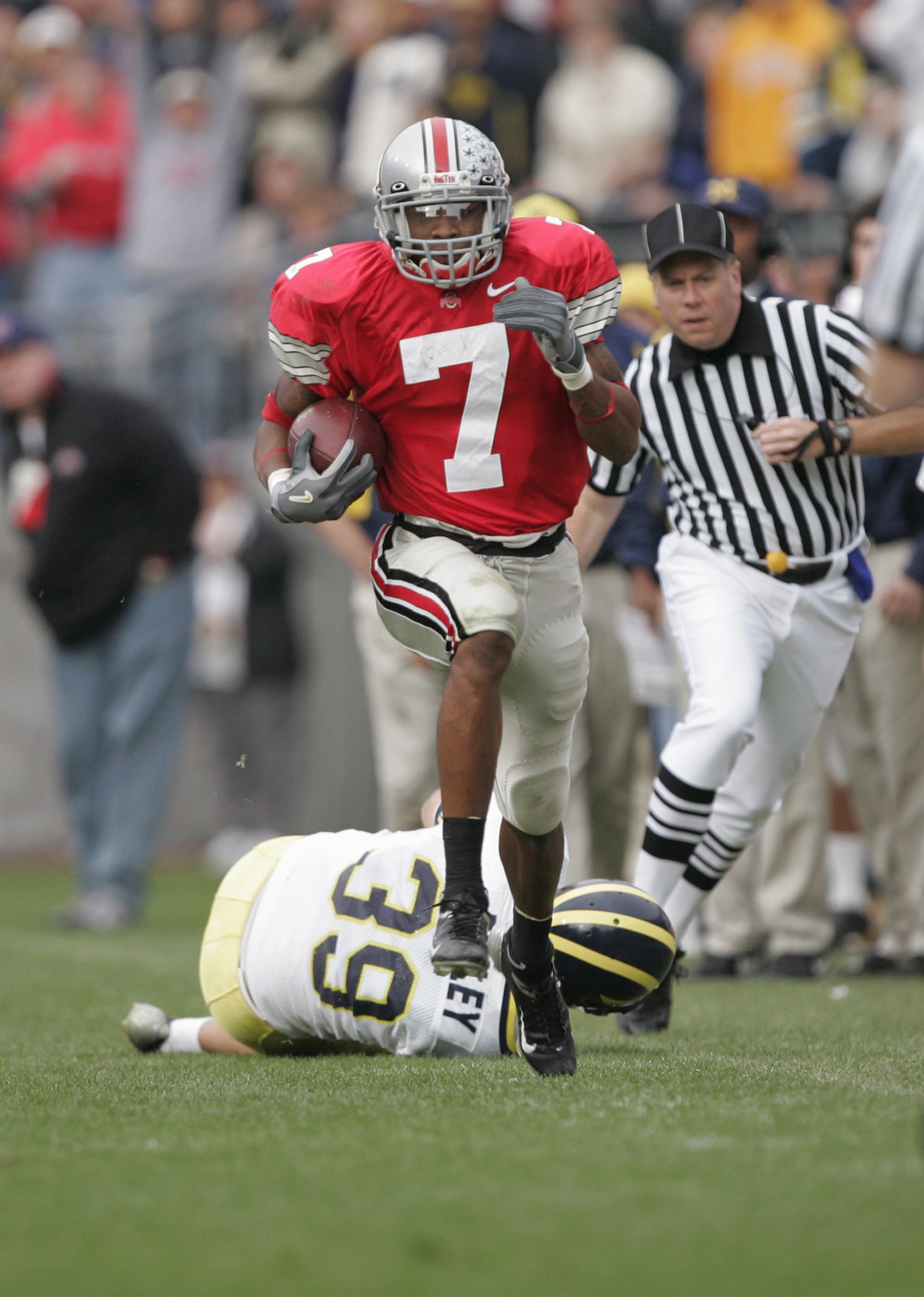 COLUMBUS, OH - NOVEMBER 20:  Defensive back Ted Ginn Jr. #7 of the Ohio State University Buckeyes returns a punt against the University of Michigan Wolverines during the game on November 20, 2004 at Ohio Stadium in Columbus, Ohio.  Ohio State defeated Mic