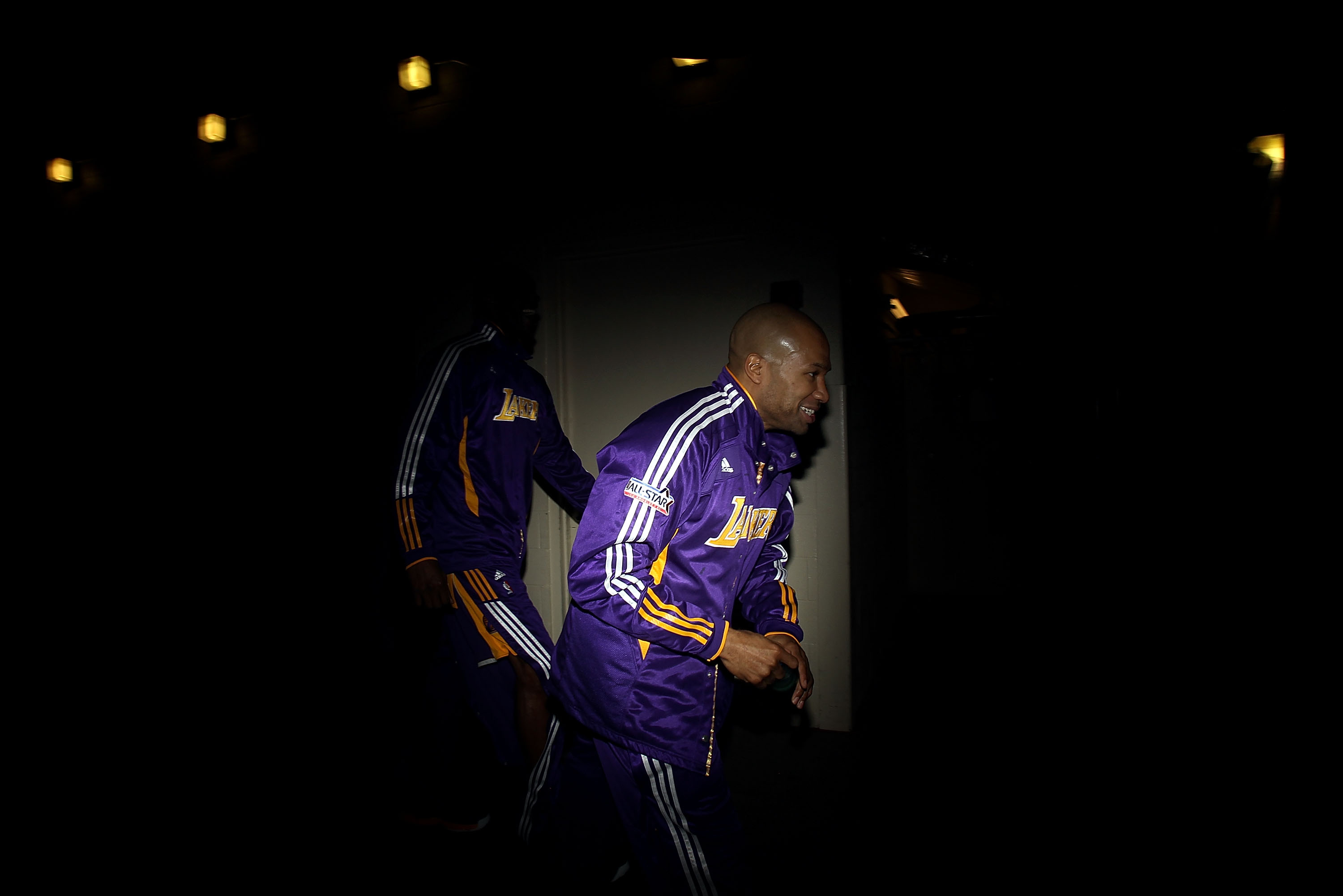 DALLAS, TX - JANUARY 19:  Guard Derek Fisher #2 of the Los Angeles Lakers runs to the court before a game against the Dallas Mavericks at American Airlines Center on January 19, 2011 in Dallas, Texas.  NOTE TO USER: User expressly acknowledges and agrees