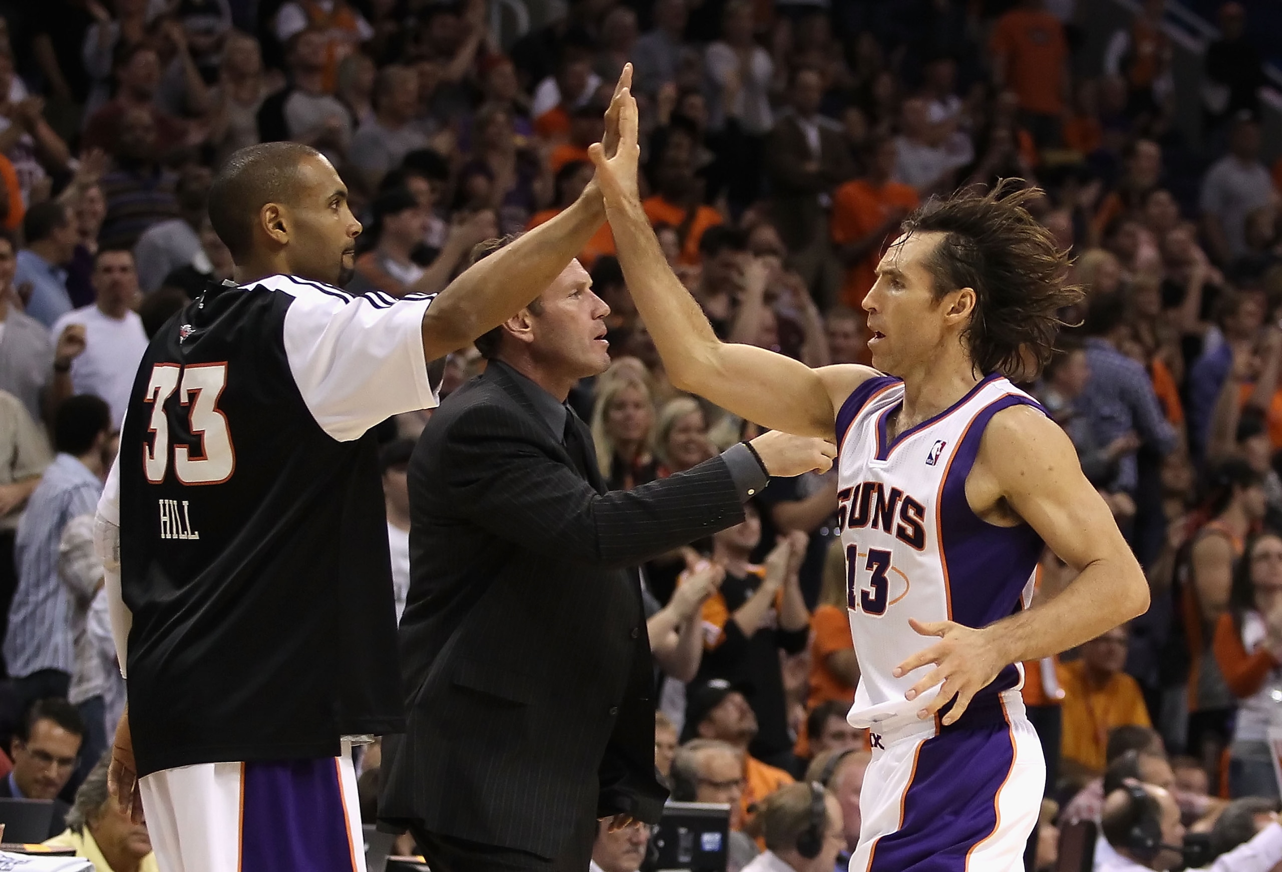 PHOENIX - NOVEMBER 05:  Steve Nash #13 of the Phoenix Suns high fives teammate Grant Hill #33 during the NBA game against the Memphis Grizzlies at US Airways Center on November 5, 2010 in Phoenix, Arizona.  The Suns defeated the Grizzlies 123-118 in doubl