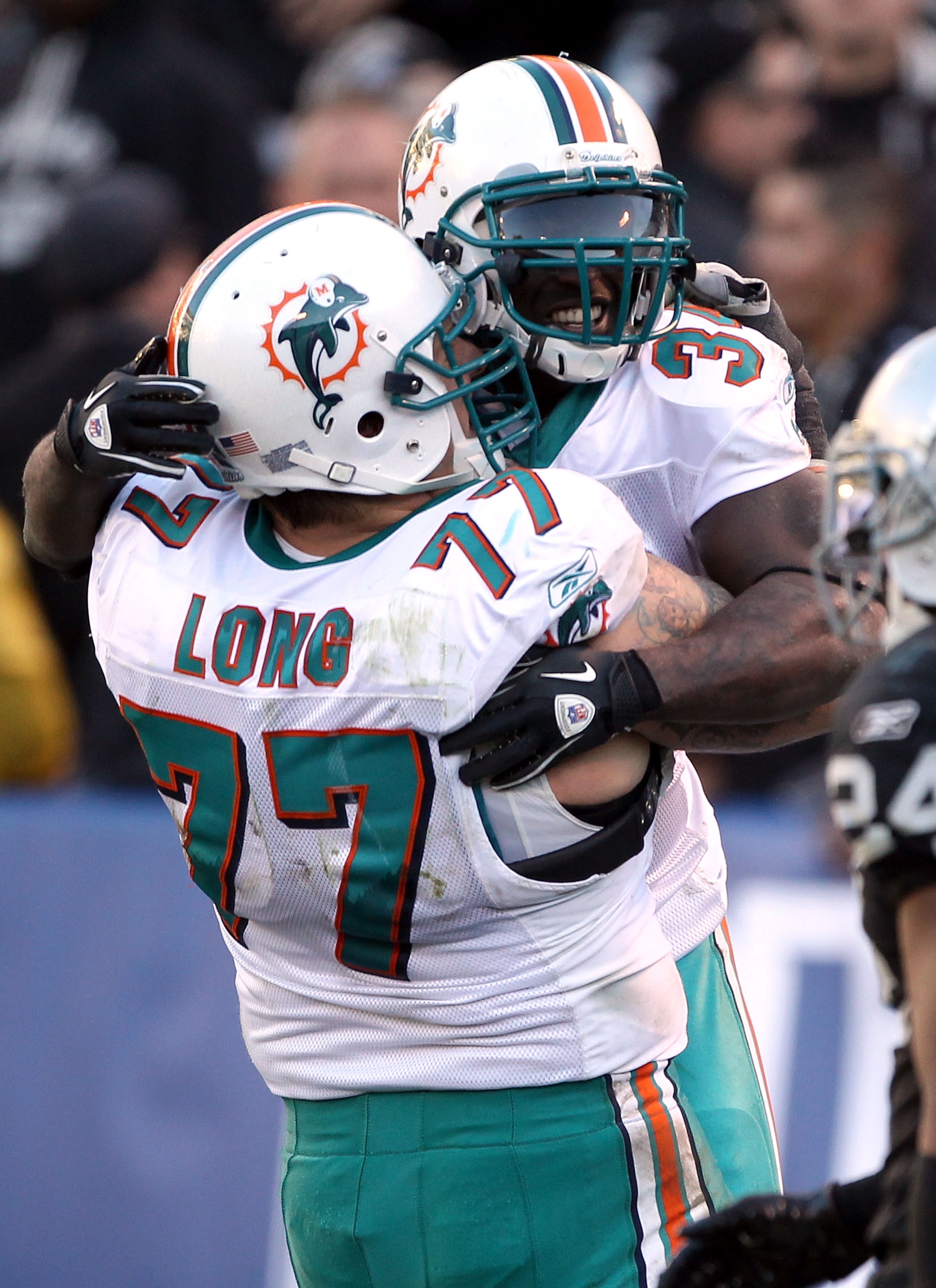 OAKLAND, CA - NOVEMBER 28:  Ricky Williams #34 of the Miami Dolphins celebrates with Jake Long #77 after Williams scored a touchdown during their game against the Oakland Raiders at Oakland-Alameda County Coliseum on November 28, 2010 in Oakland, Californ