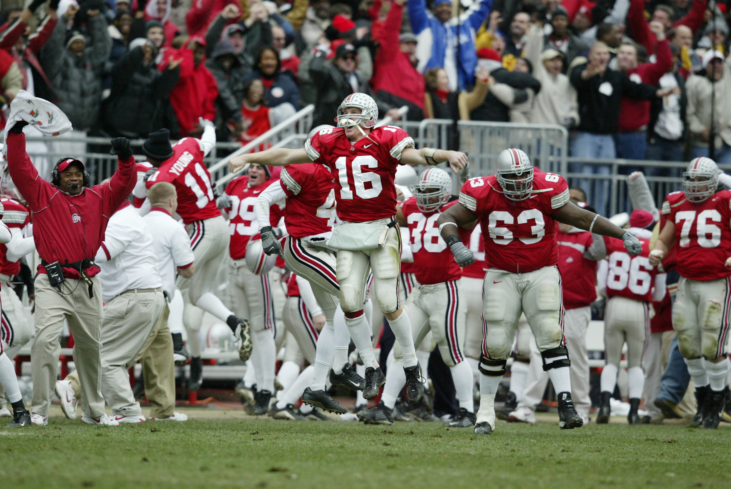 COLUMBUS, OH - NOVEMBER 23: Craig Krenzel #16 of Ohio State celebrates with his teammates after Michigan turned the ball over late in the game on November 23, 2002 at Ohio Stadium in Columbus, Ohio.  Ohio State won the game, 14-9. (Photo by Tom Pidgeon/Ge