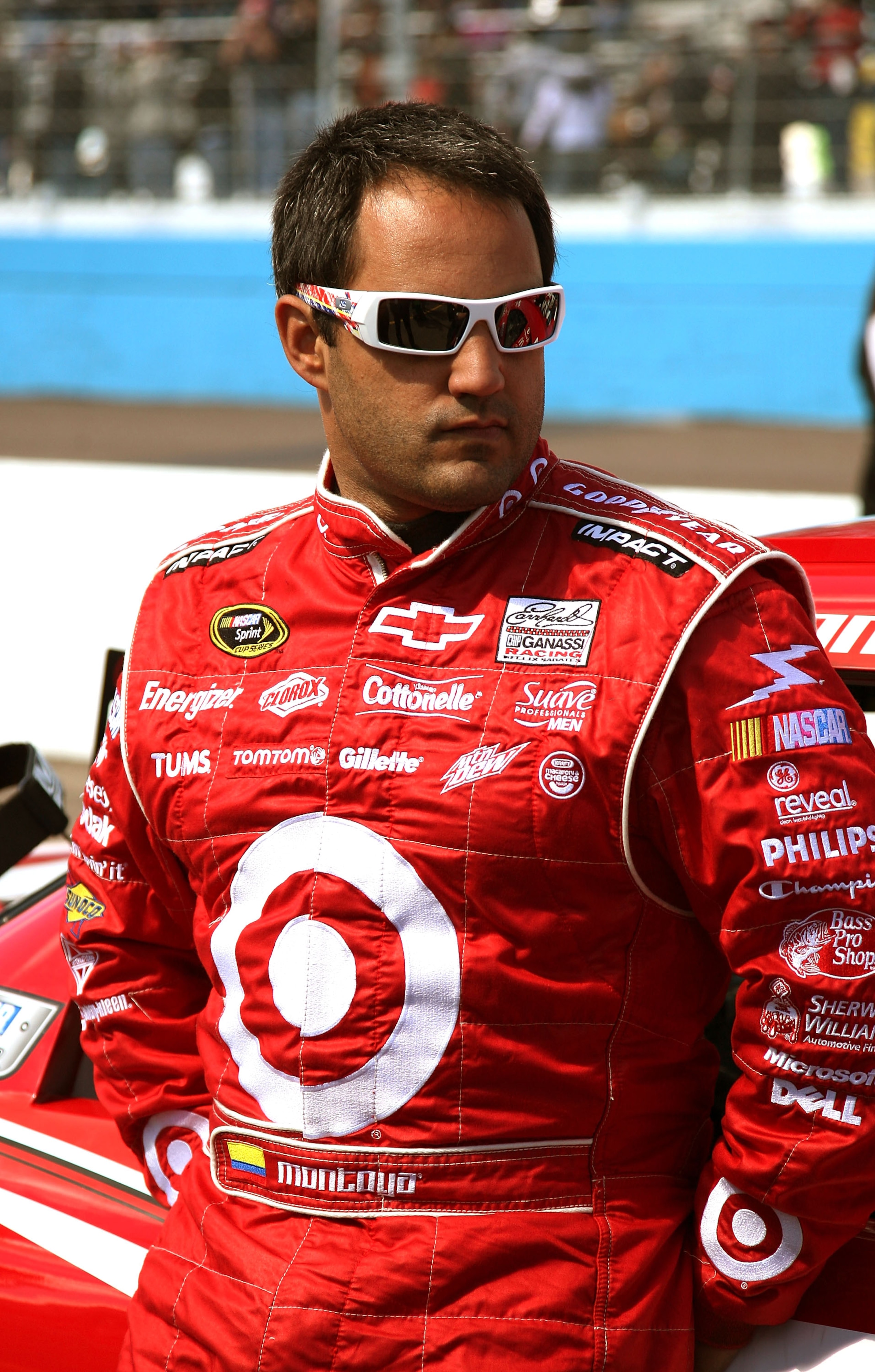 AVONDALE, AZ - FEBRUARY 27:  Juan Pablo Montoya, driver of the #42 Target Chevrolet, leans on his car prior to the NASCAR Sprint Cup Series Subway Fresh Fit 500 at Phoenix International Raceway on February 27, 2011 in Avondale, Arizona.  (Photo by Jerry M