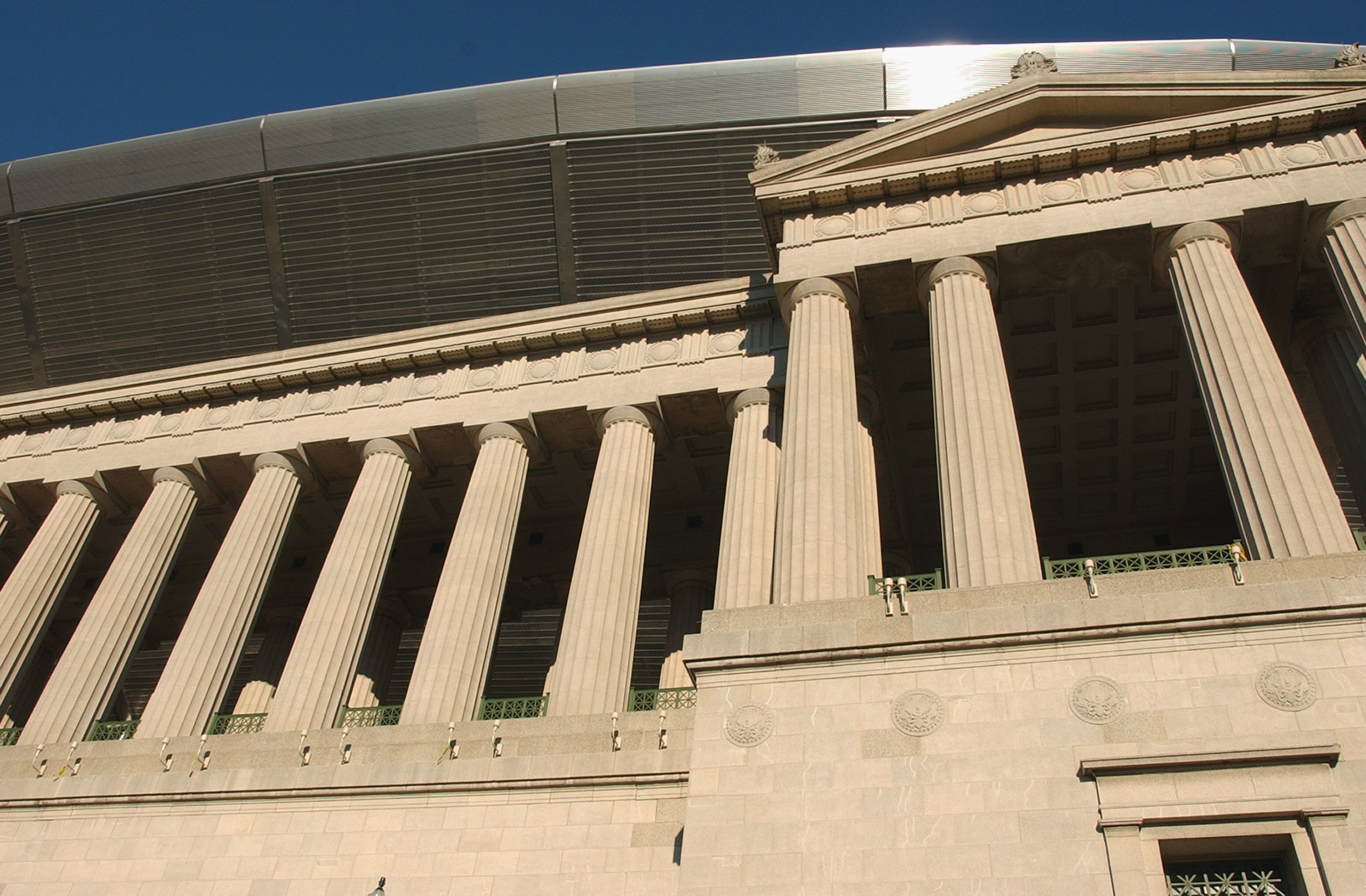 CHICAGO - SEPTEMBER 18:  A general view of the west side of rebuilt Soldier Field stadium, home to the NFL Chicago Bears and the MLS Chicago Fire, showing the old colonnade with the new stadium towering above during a media tour on September 18, 2003 in C