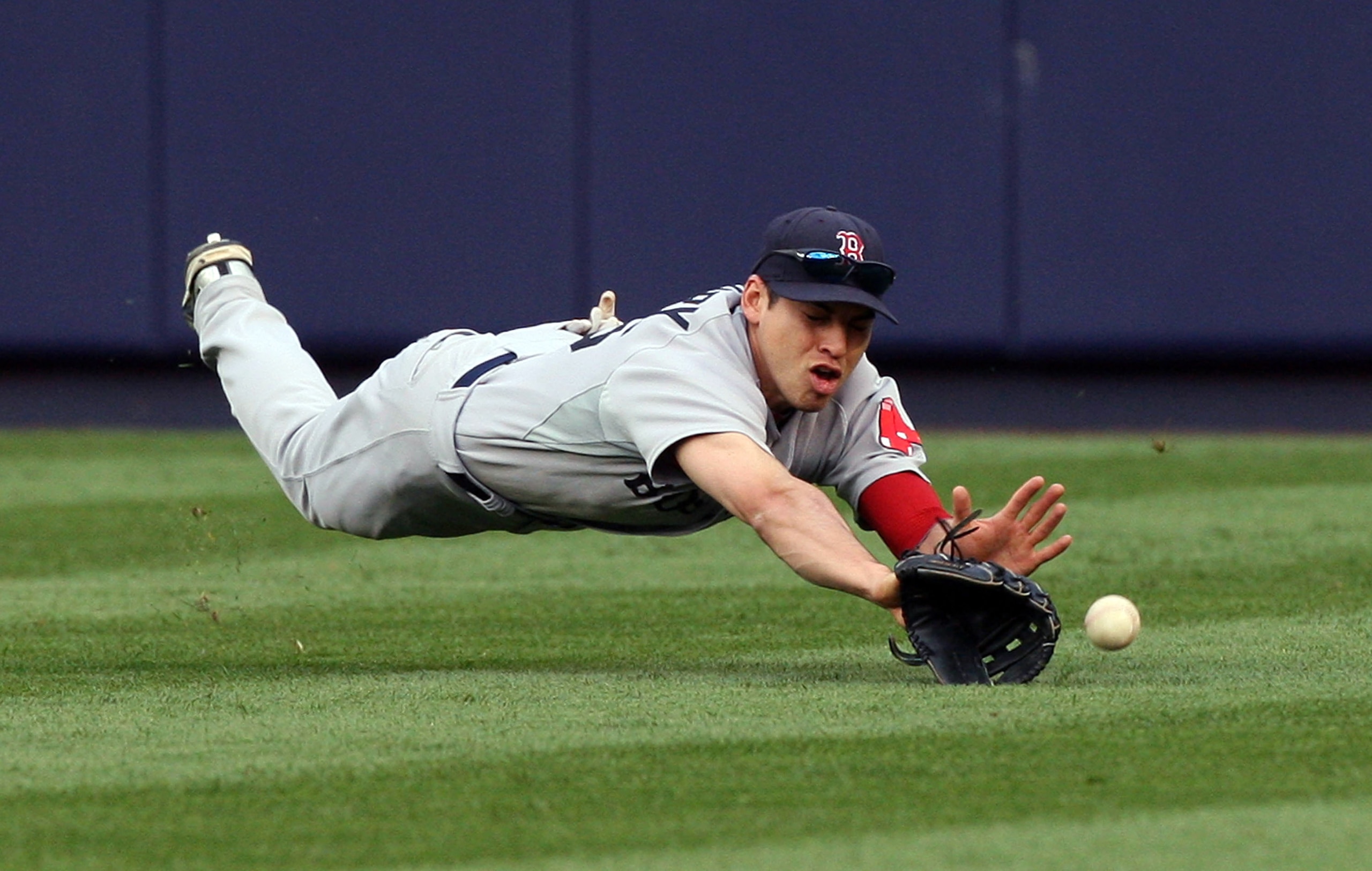 NEW YORK - SEPTEMBER 26:  Jacoby Ellsbury #46 of the Boston Red Sox can't come up with a ball hit by Mark Teixeira (not pictured) of the New York Yankees in the third inning on September 26, 2009 at Yankee Stadium in the Bronx borough of New York City.  (
