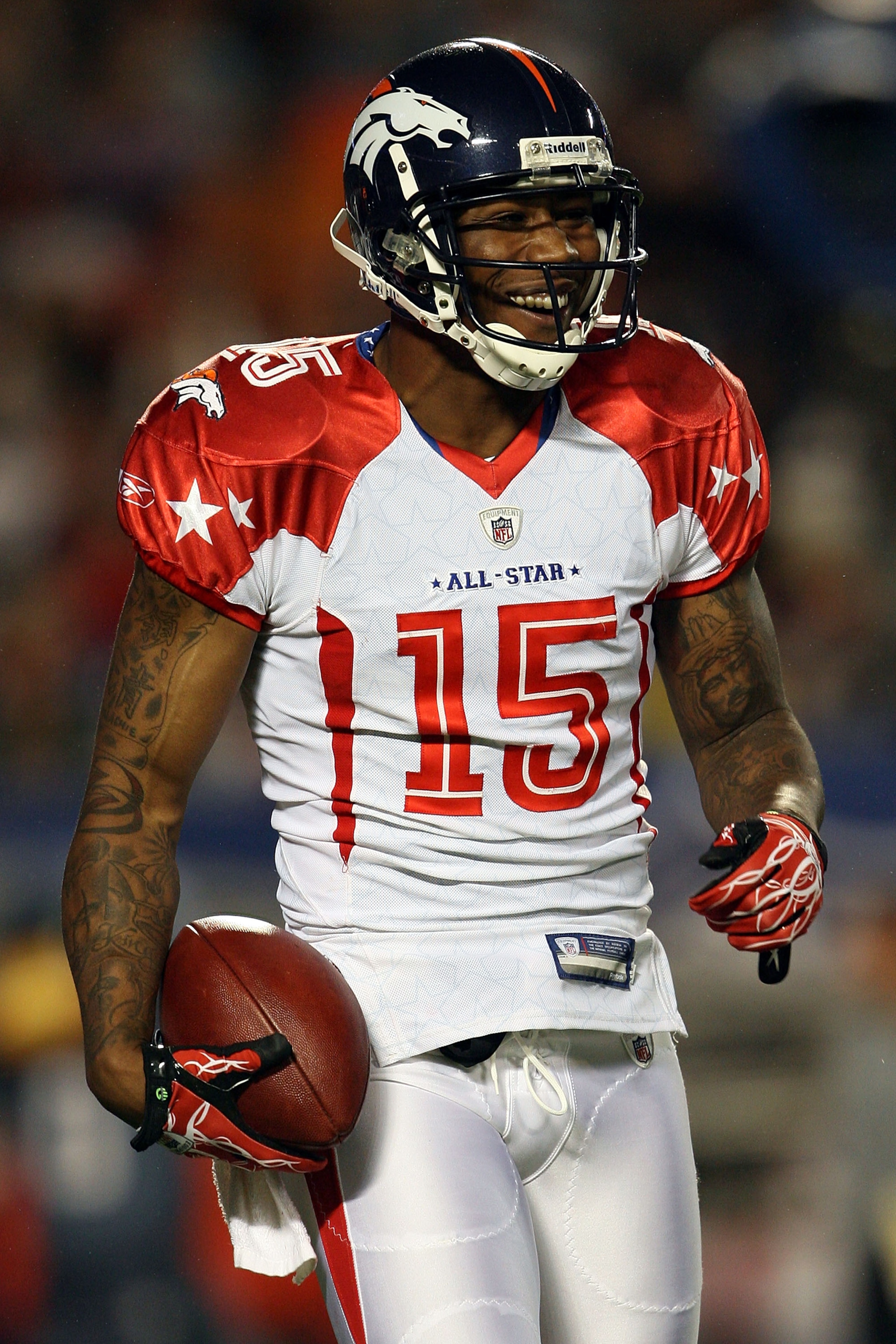 MIAMI GARDENS, FL - JANUARY 31:  Brandon Marshall of the Denver Broncos celebrates after scoring a touchdown during the 2010 AFC-NFC Pro Bowl at Sun Life Stadium on January 31, 2010 in Miami Gardens, Florida.  (Photo by Doug Benc/Getty Images)