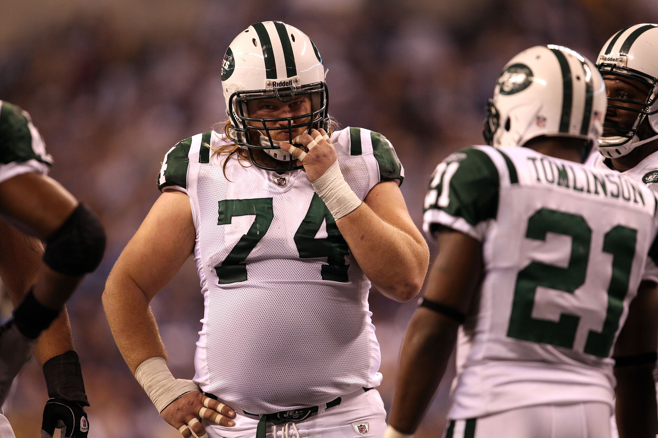 INDIANAPOLIS, IN - JANUARY 08:  Nick Mangold #74 of the New York Jets looks on against the Indianapolis Colts during their 2011 AFC wild card playoff game at Lucas Oil Stadium on January 8, 2011 in Indianapolis, Indiana. The Jets won 17-16. (Photo by Jona