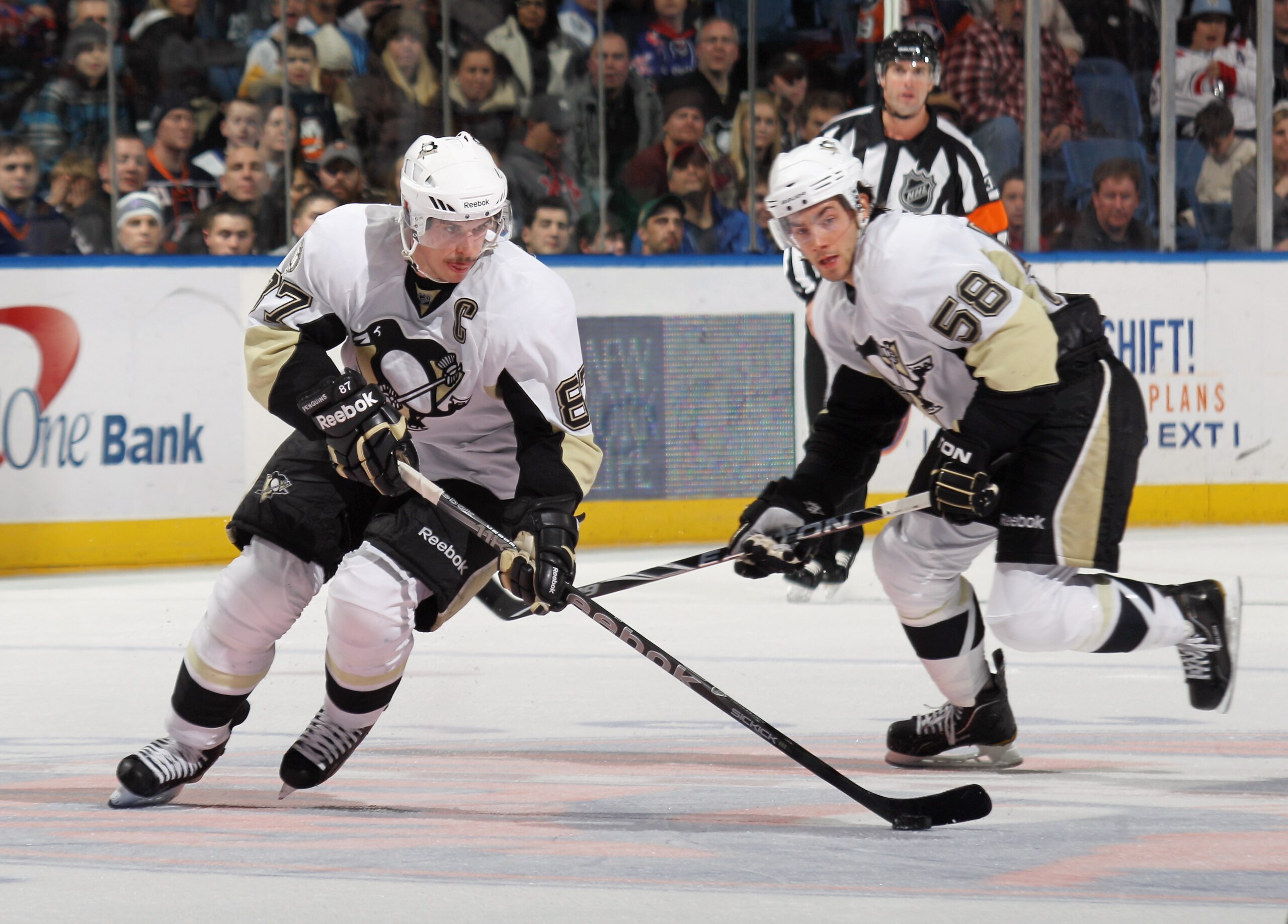 UNIONDALE, NY - DECEMBER 29:  Sidney Crosby #87 and Kris Letang #58 of the Pittsburgh Penguins skate against the New York Islanders at the Nassau Coliseum on December 29, 2010 in Uniondale, New York.  (Photo by Bruce Bennett/Getty Images)