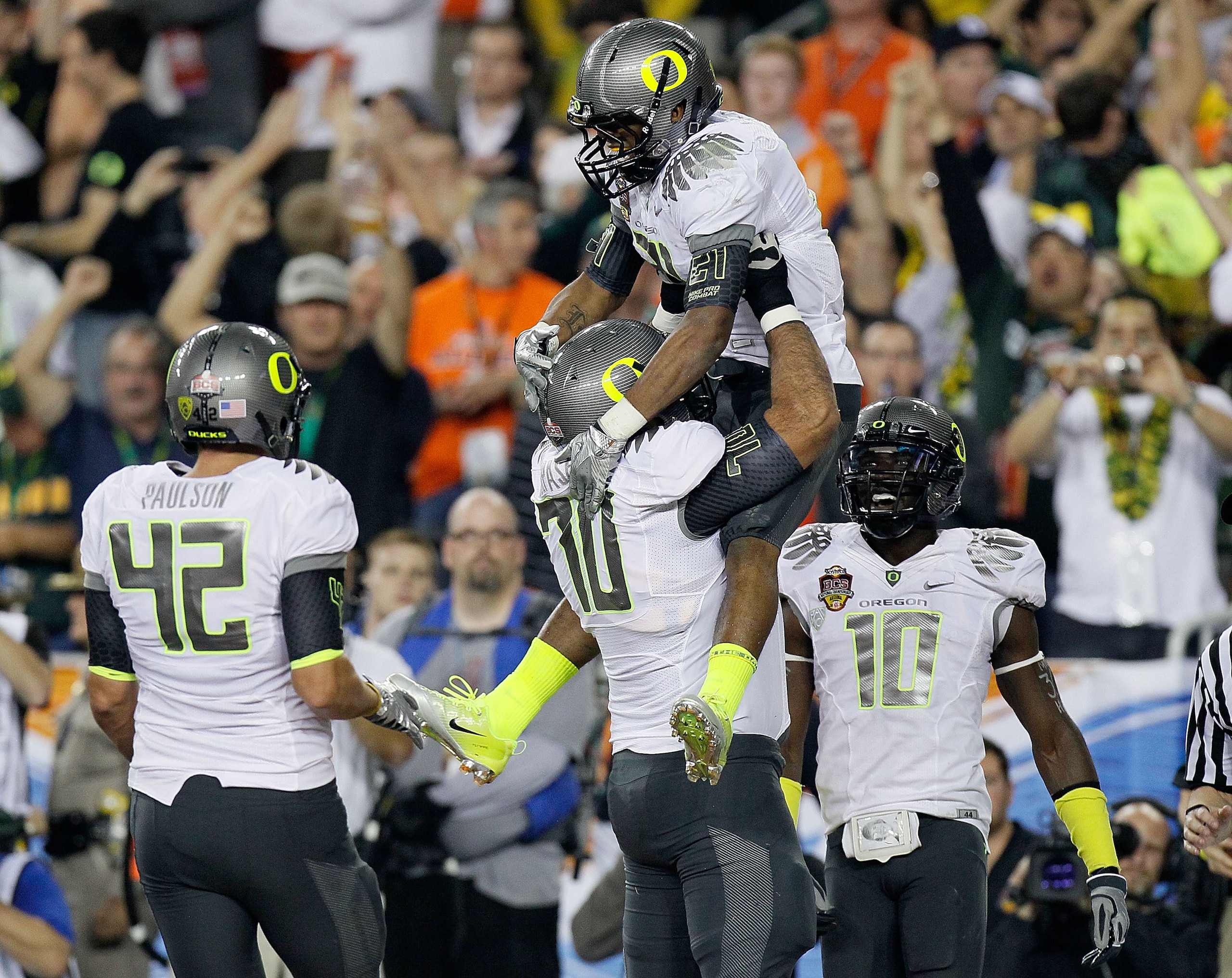 GLENDALE, AZ - JANUARY 10:  (R-L) LaMichael James #21 and Ramsen Golpashin #70 of the Oregon Ducks celebrate James' eight-yard touchdown reception in the second quarter against the Auburn Tigers during the Tostitos BCS National Championship Game at Univer