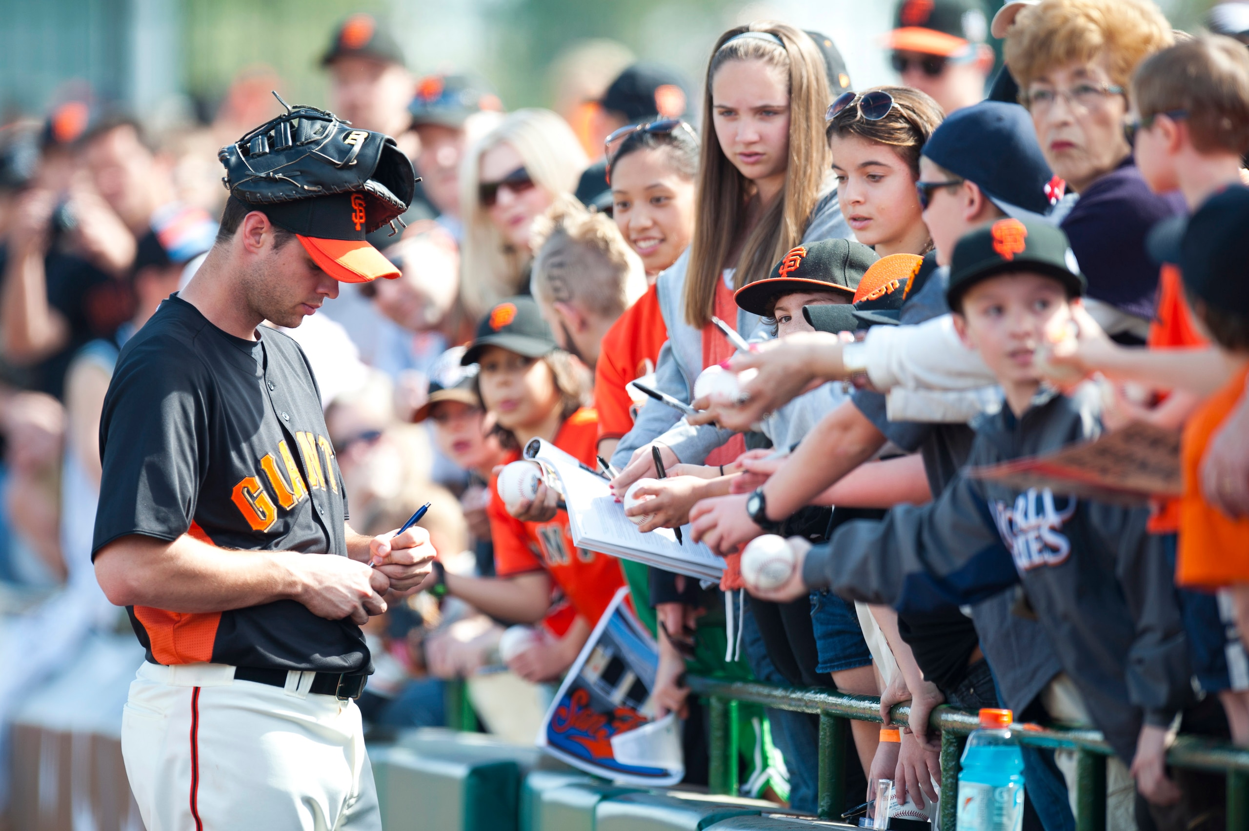 SCOTTSDALE, AZ - FEBRUARY 25: Brandon Belt #9 of the San Francisco Giants signs autographs before a spring training game against the Arizona Diamondbacks at Scottsdale Stadium on February 25, 2011 in Scottsdale, Arizona. (Photo by Rob Tringali/Getty Image