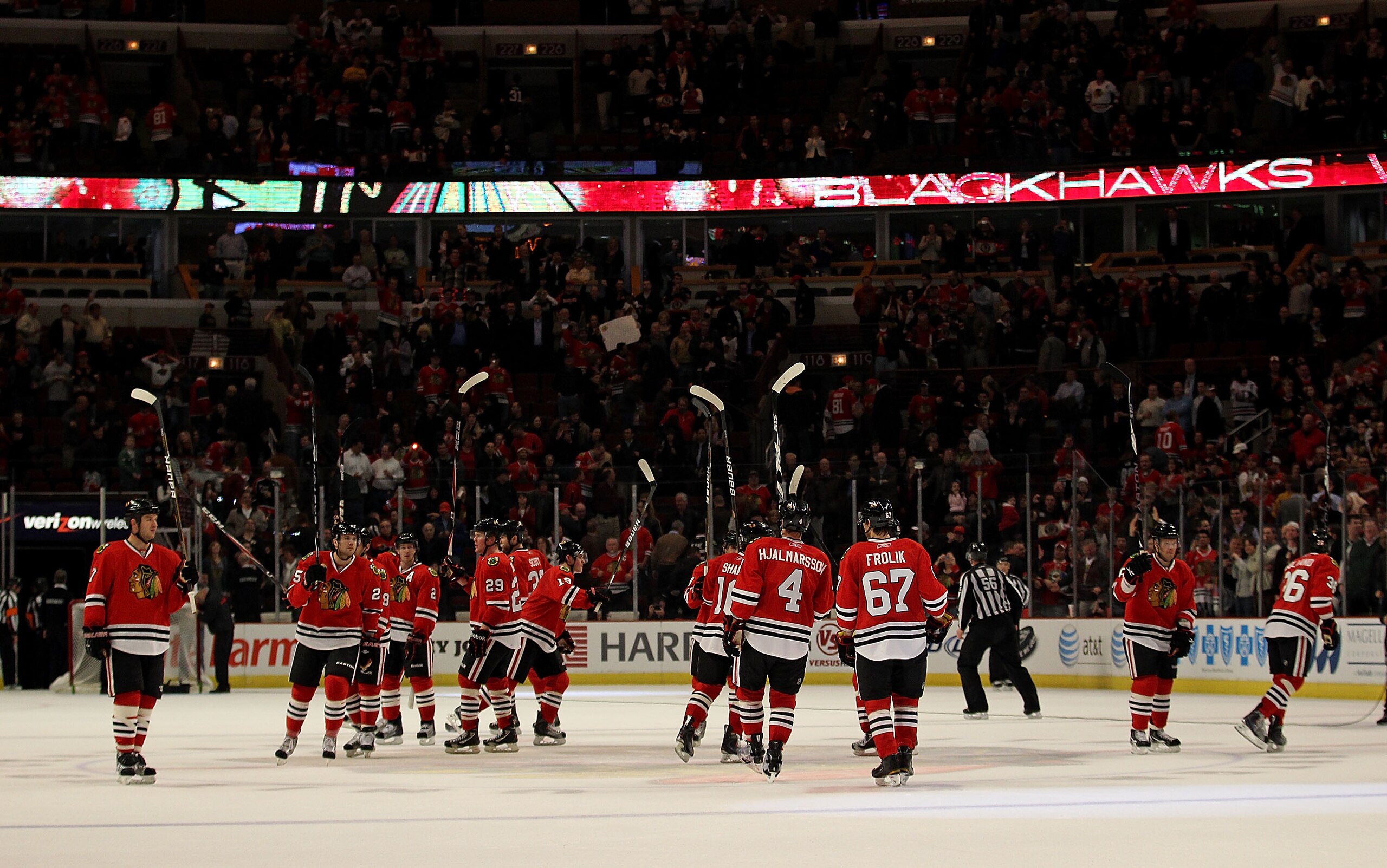 CHICAGO, IL - FEBRUARY 16: Members of the Chicago Blackhawks salute the crowd after a win over the Minnesota Wild at the United Center on February 16, 2011 in Chicago, Illinois. The Blackhawks defeated the Wild 3-1. (Photo by Jonathan Daniel/Getty Images)