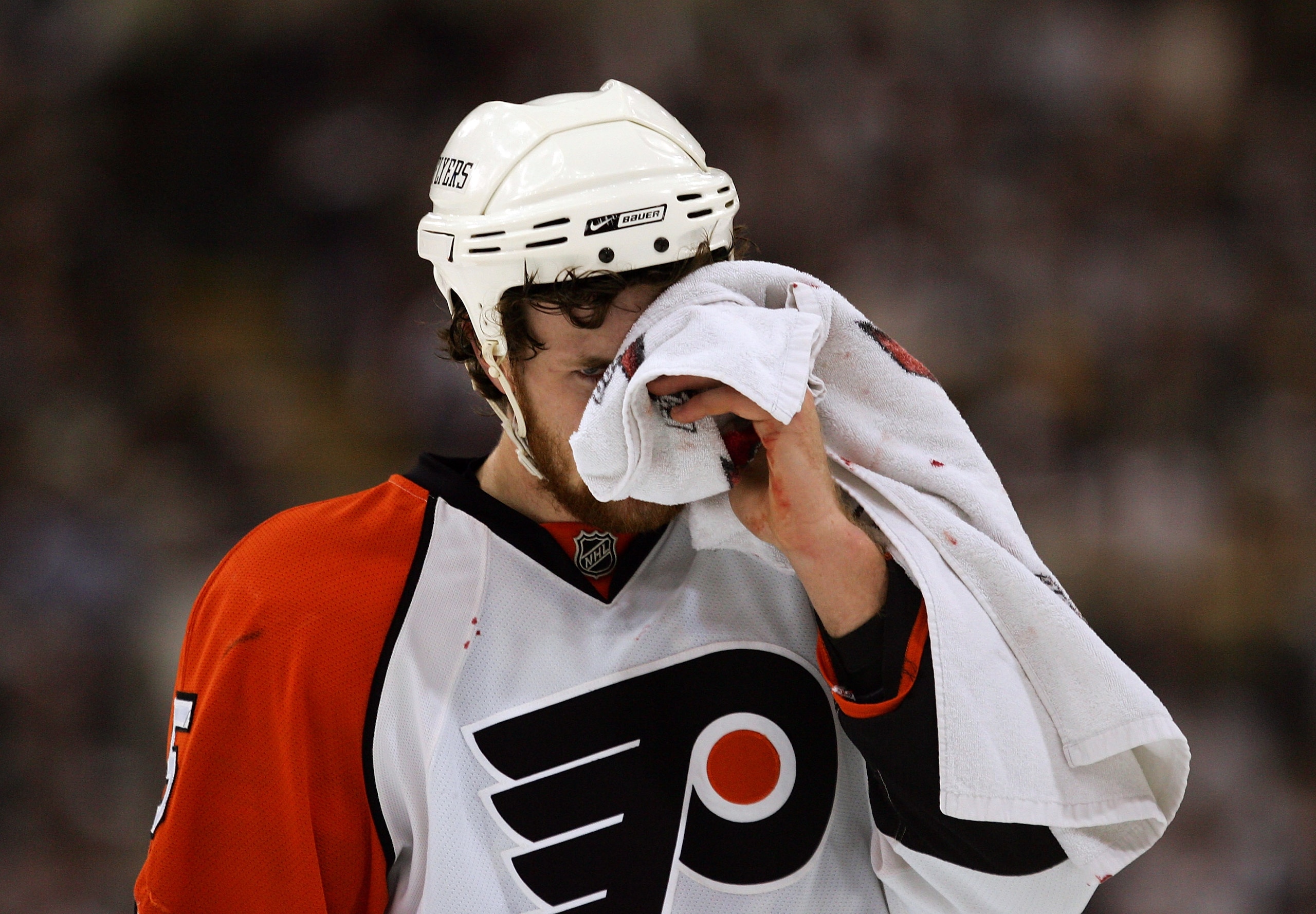 PITTSBURGH - MAY 11:  Braydon Coburn #5 of the Philadelphia Flyers skates off the ice holding a towel over his injury during the first period of game two of the Eastern Conference Finals of the 2008 NHL Stanley Cup Playoffs against the Pittsburgh Penguins