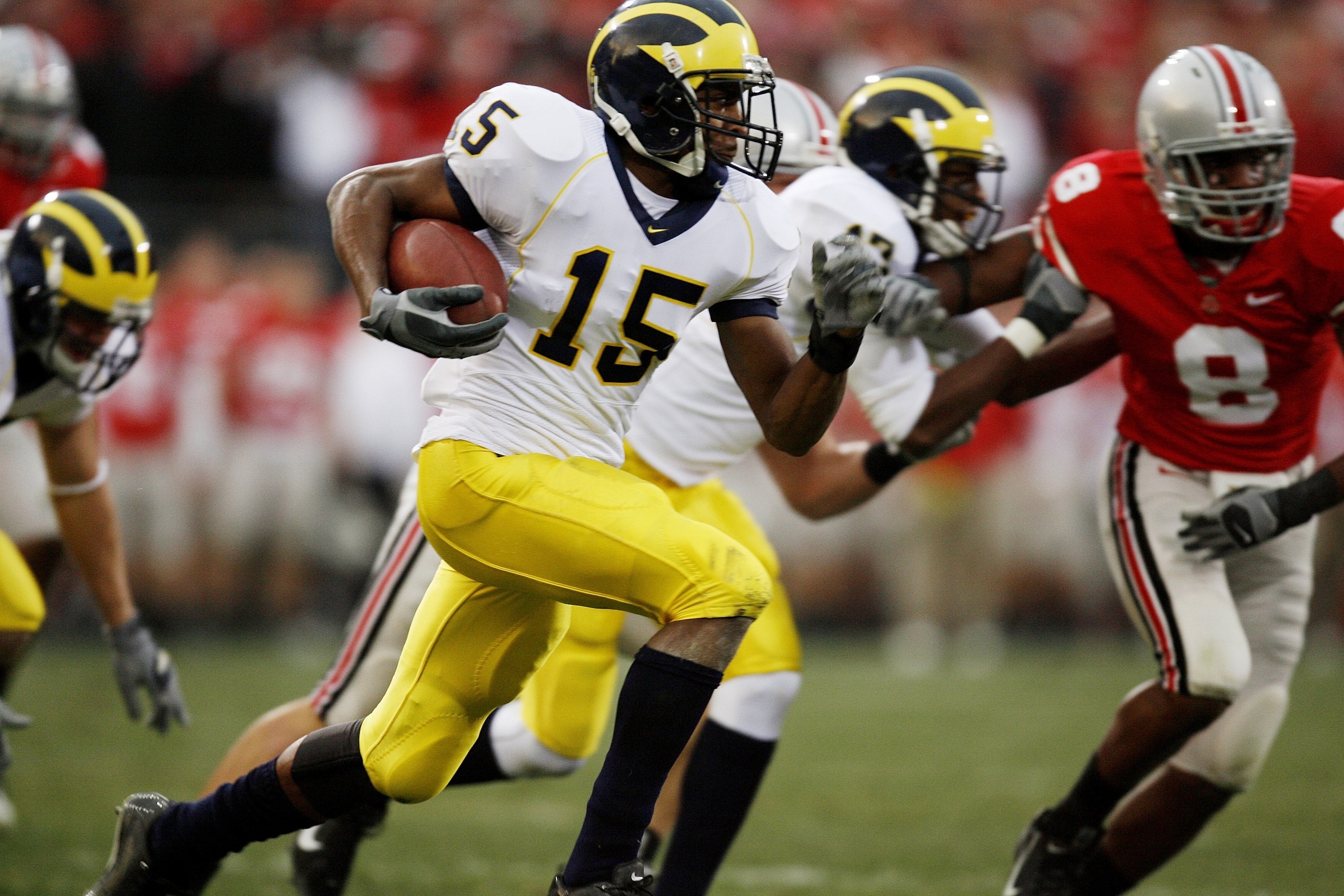 COLUMBUS, OH - NOVEMBER 18:  Wide receiver Steve Breaston #15 of the Michigan Wolverines runs with the ball against the Ohio State Buckeyes on November 18, 2006 at Ohio Stadium in Columbus, Ohio.  Ohio State won 42-39.  (Photo by Gregory Shamus/Getty Imag