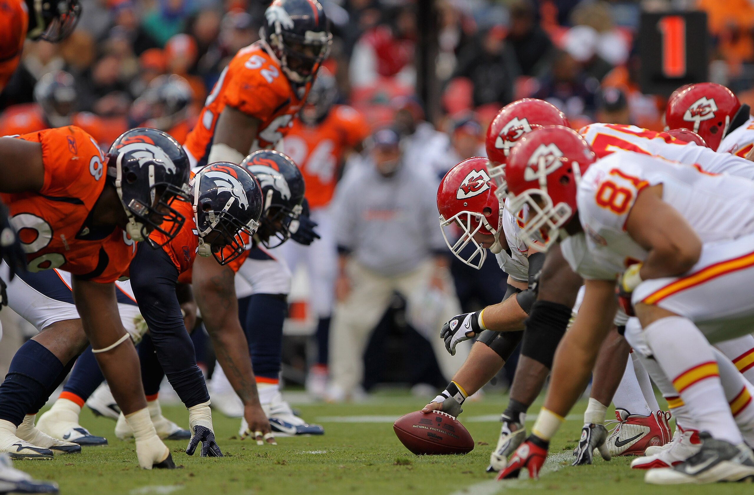DENVER - NOVEMBER 14:  The Kansas City Chiefs offensive line prepares to snap the ball against the Denver Broncos defense at INVESCO Field at Mile High on November 14, 2010 in Denver, Colorado. The Broncos defeated the Chiefs 49-29.  (Photo by Doug Pensin