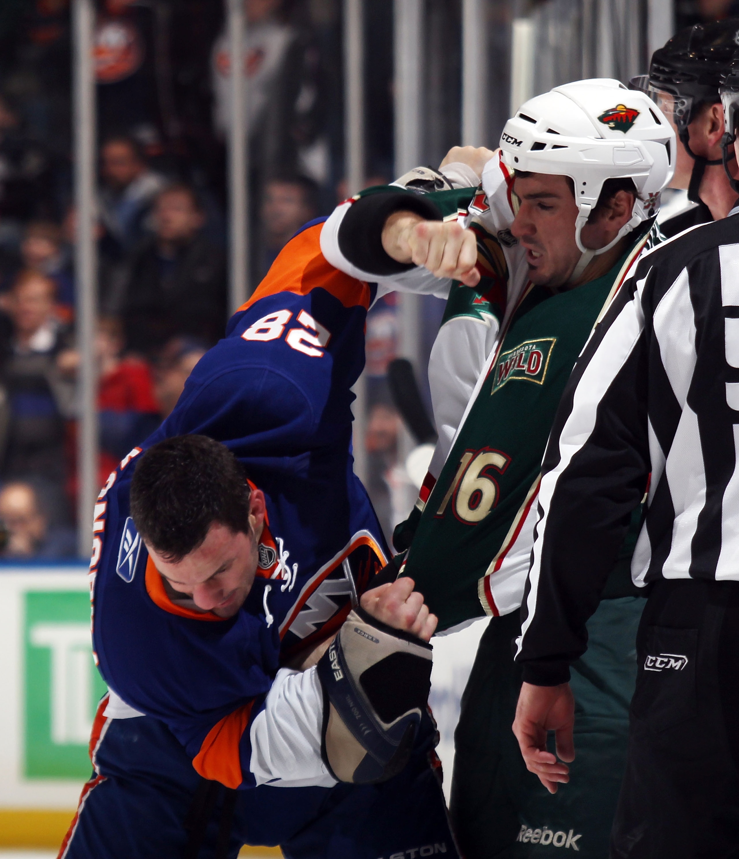 UNIONDALE, NY - MARCH 02: Zenon Konopka #28 of the New York Islanders fights with Brad Staubitz #16 of the Minnesota Wild at the Nassau Coliseum on March 2, 2011 in Uniondale, New York. The Islanders defeated the Wild 4-1.  (Photo by Bruce Bennett/Getty I