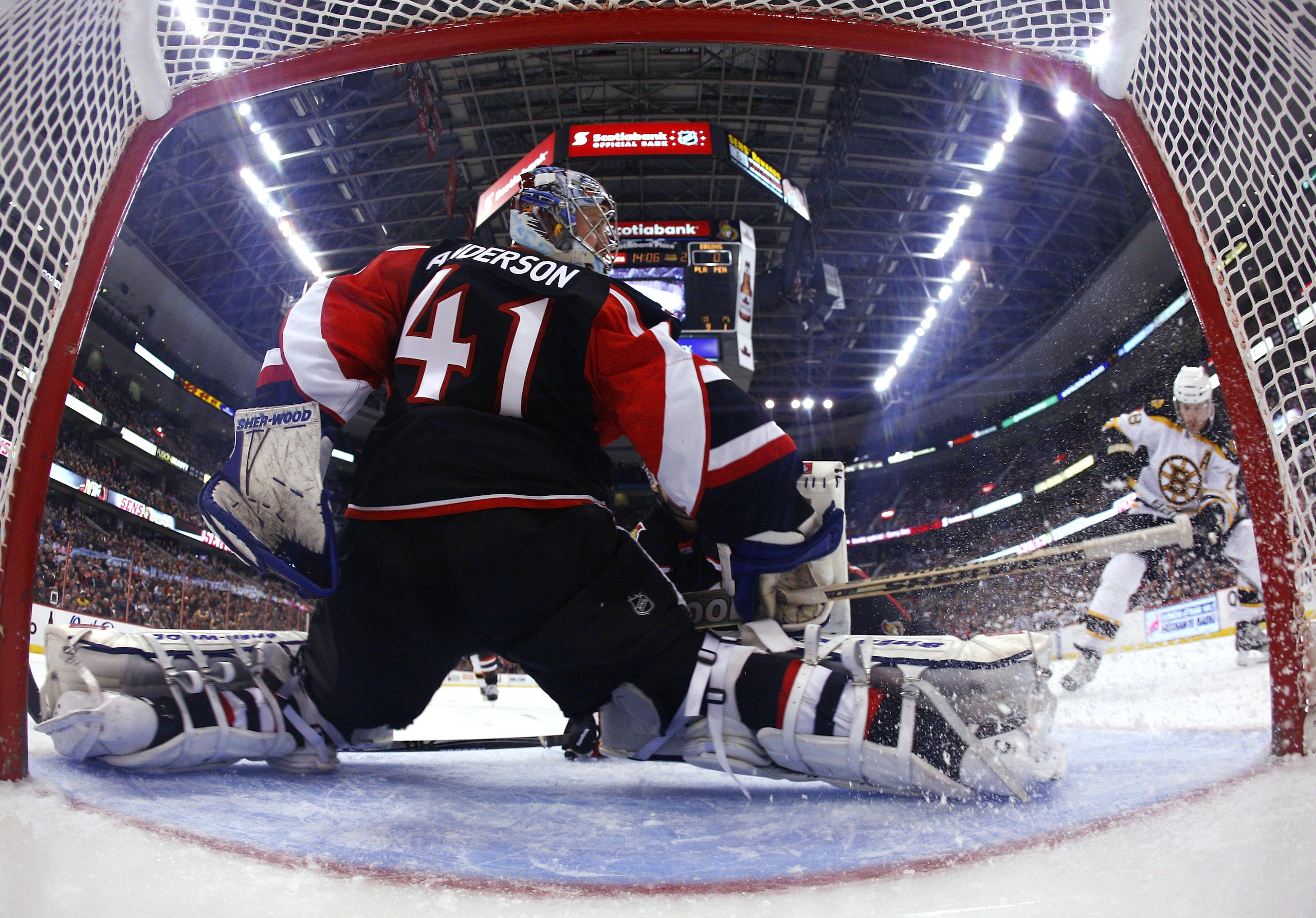 OTTAWA, CANADA - MARCH 01:  Craig Anderson #41 of the Ottawa Senators makes a pad save off a shot by Mark Recchi #28 of the Boston Bruins during a game at Scotiabank Place on March 1, 2011 in Ottawa, Canada.  (Photo by Phillip MacCallum/Getty Images)