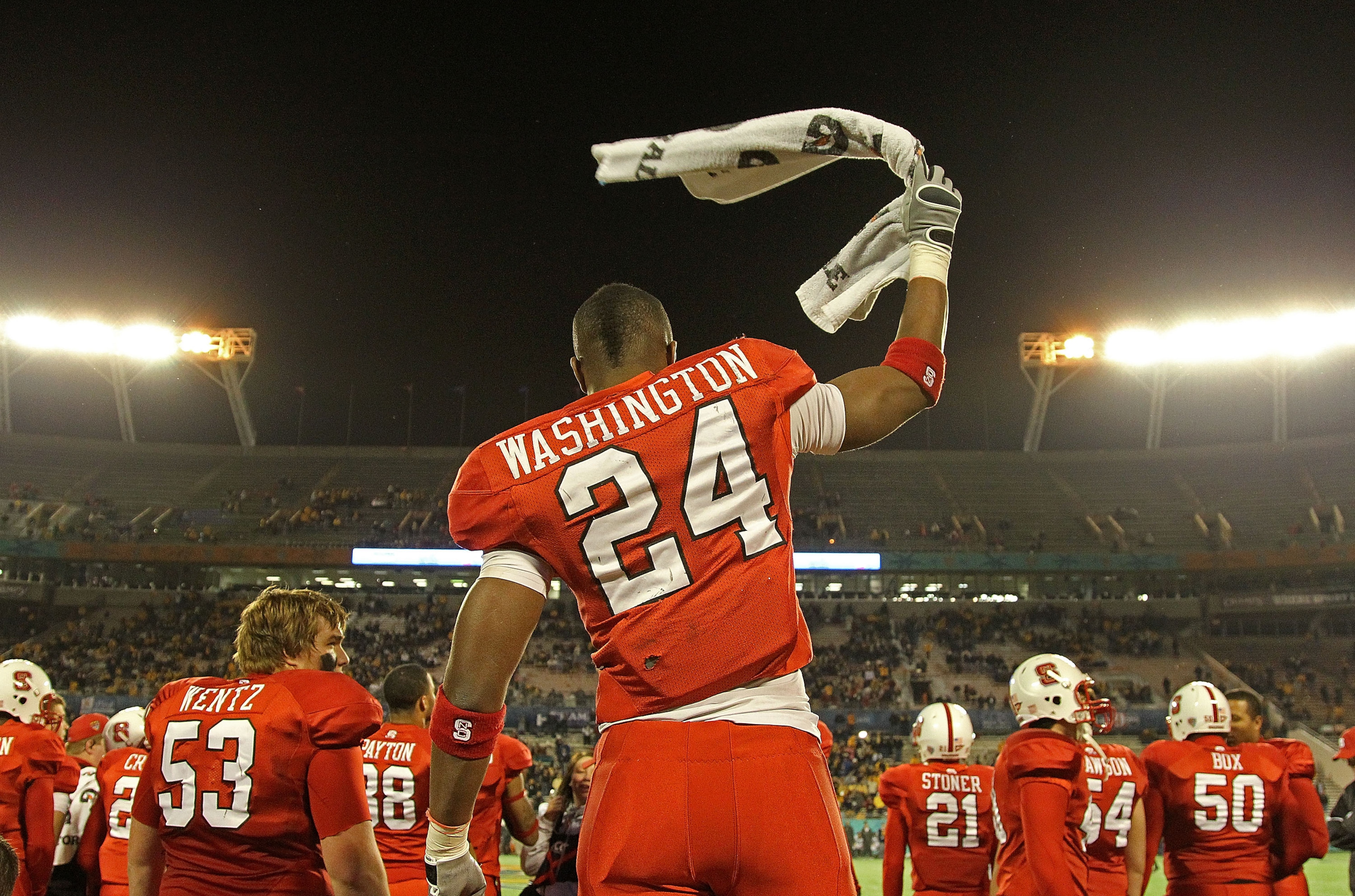 ORLANDO, FL - DECEMBER 28:  James Washington #24 of the North Carolina State Wolfpack celebrates after winning  the Champs Sports Bowl against the West Virginia Mountineers at Florida Citrus Bowl Stadium on December 28, 2010 in Orlando, Florida.  (Photo b