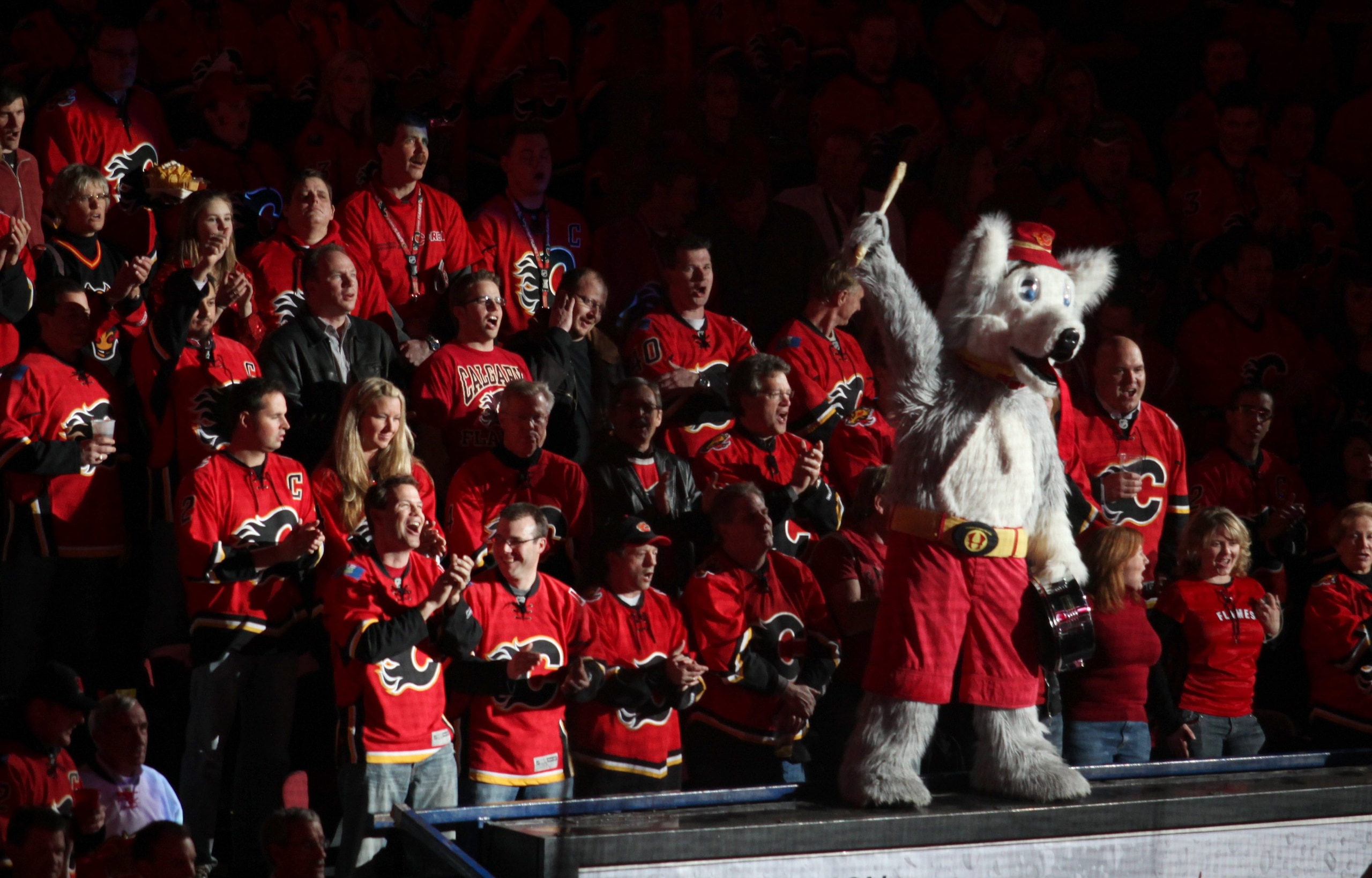 CALGARY, AB - APRIL 27: The Calgary Flames mascot 'Harvey the Hound'  leads fans in a cheer before the Flames played the Chicago Blackhawks  in Game Six of the Western Conference Quarterfinals of the 2009 Stanley Cup Playoffs on April 27, 2009 at the Peng