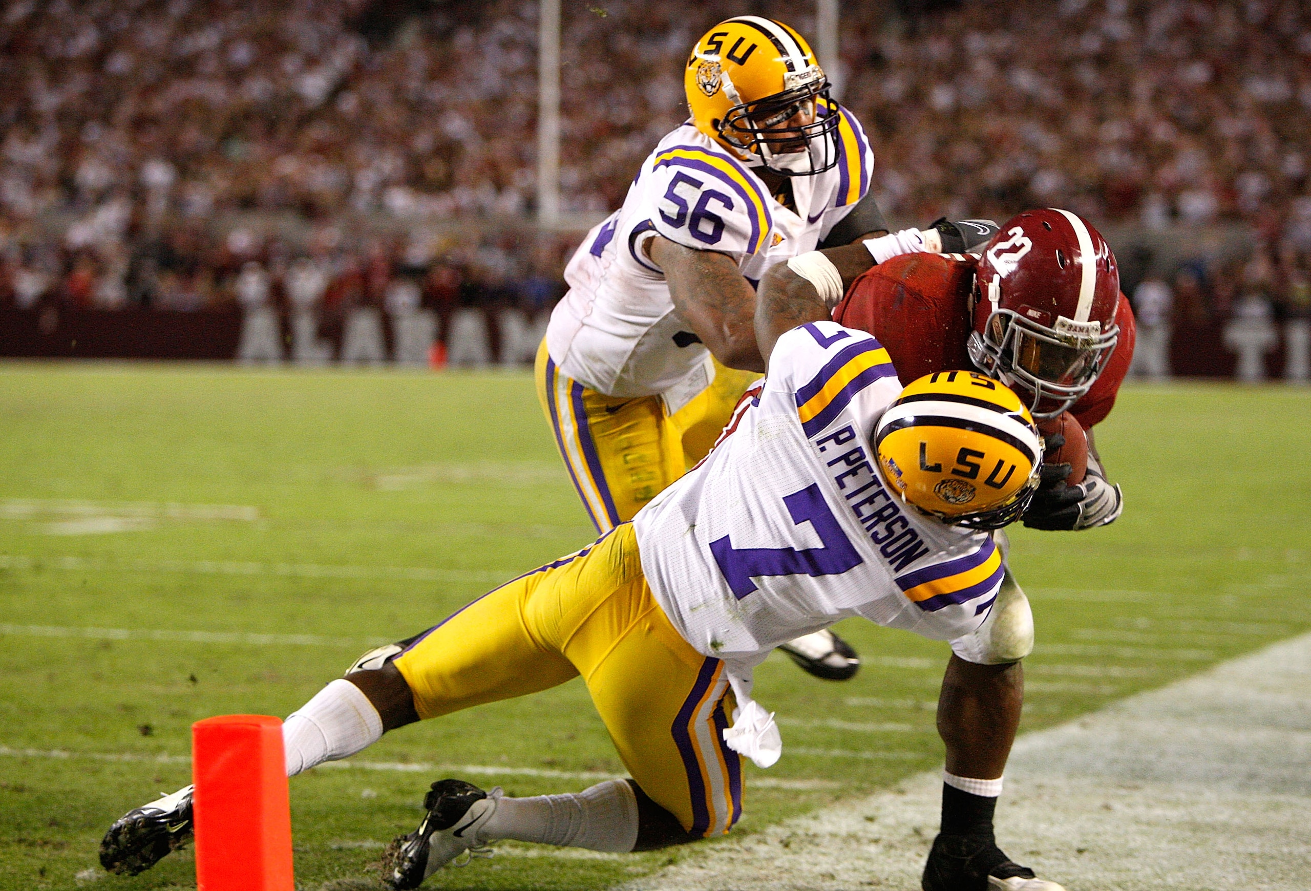 TUSCALOOSA, AL - NOVEMBER 07: Patrick Peterson #7 of the Louisiana State University Tigers tackles Mark Ingram #22 of the Alabama Crimson Tide at Bryant-Denny Stadium on November 7, 2009 in Tuscaloosa, Alabama. (Photo by Kevin C. Cox/Getty Images) TUSCALOOSA, AL - NOVEMBER 07: Patrick Peterson #7 of the Louisiana State University Tigers tackles Mark Ingram #22 of the Alabama Crimson Tide at Bryant-Denny Stadium on November 7, 2009 in Tuscaloosa, Alabama. (Photo by Kevin C. Cox/Getty Images)