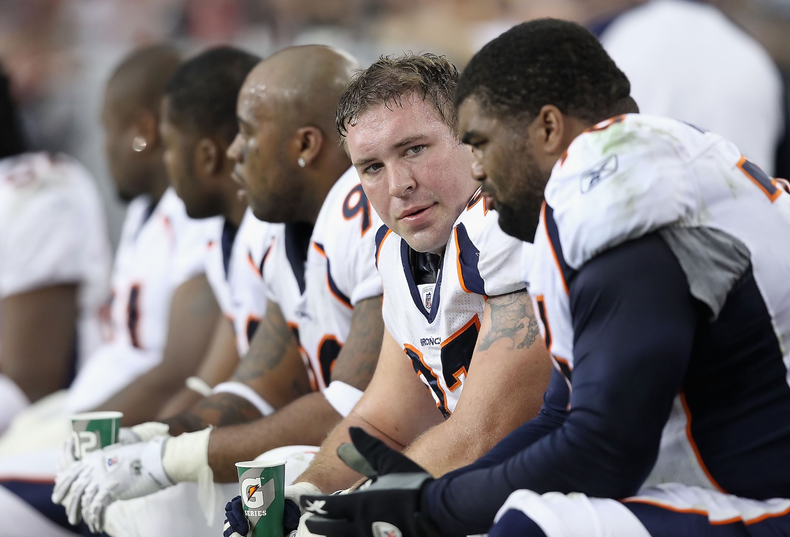 GLENDALE, AZ - DECEMBER 12: Defensive end Justin Bannan #97 of the Denver Broncos sits on the sidelines during the NFL game against the Arizona Cardinals at the University of Phoenix Stadium on December 12, 2010 in Glendale, Arizona. The Cardinals defea GLENDALE, AZ - DECEMBER 12: Defensive end Justin Bannan #97 of the Denver Broncos sits on the sidelines during the NFL game against the Arizona Cardinals at the University of Phoenix Stadium on December 12, 2010 in Glendale, Arizona. The Cardinals defea