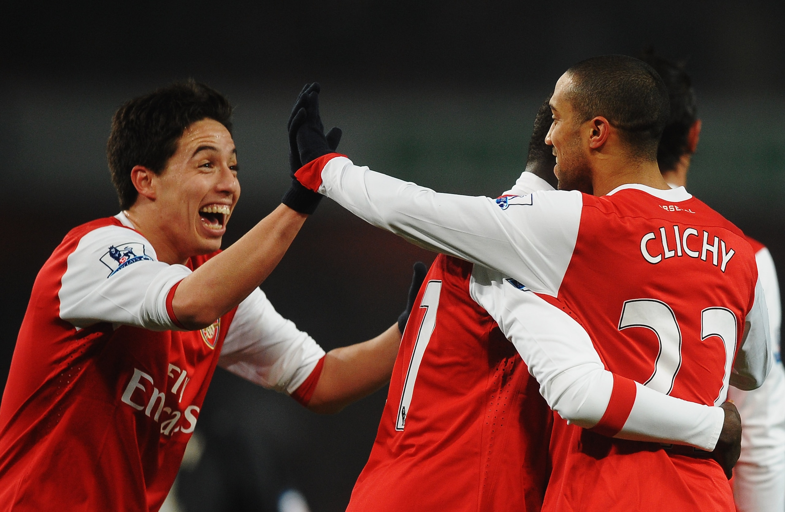 LONDON, UNITED KINGDOM - MARCH 02:  Gael Clichy (R) of Arsenal celebrates with team mate Samir Nasri (L) after scoring his sides fifth goal during the FA Cup sponsored by E.ON 5th Round Replay match between between Arsenal and Leyton Orient at the Emirate