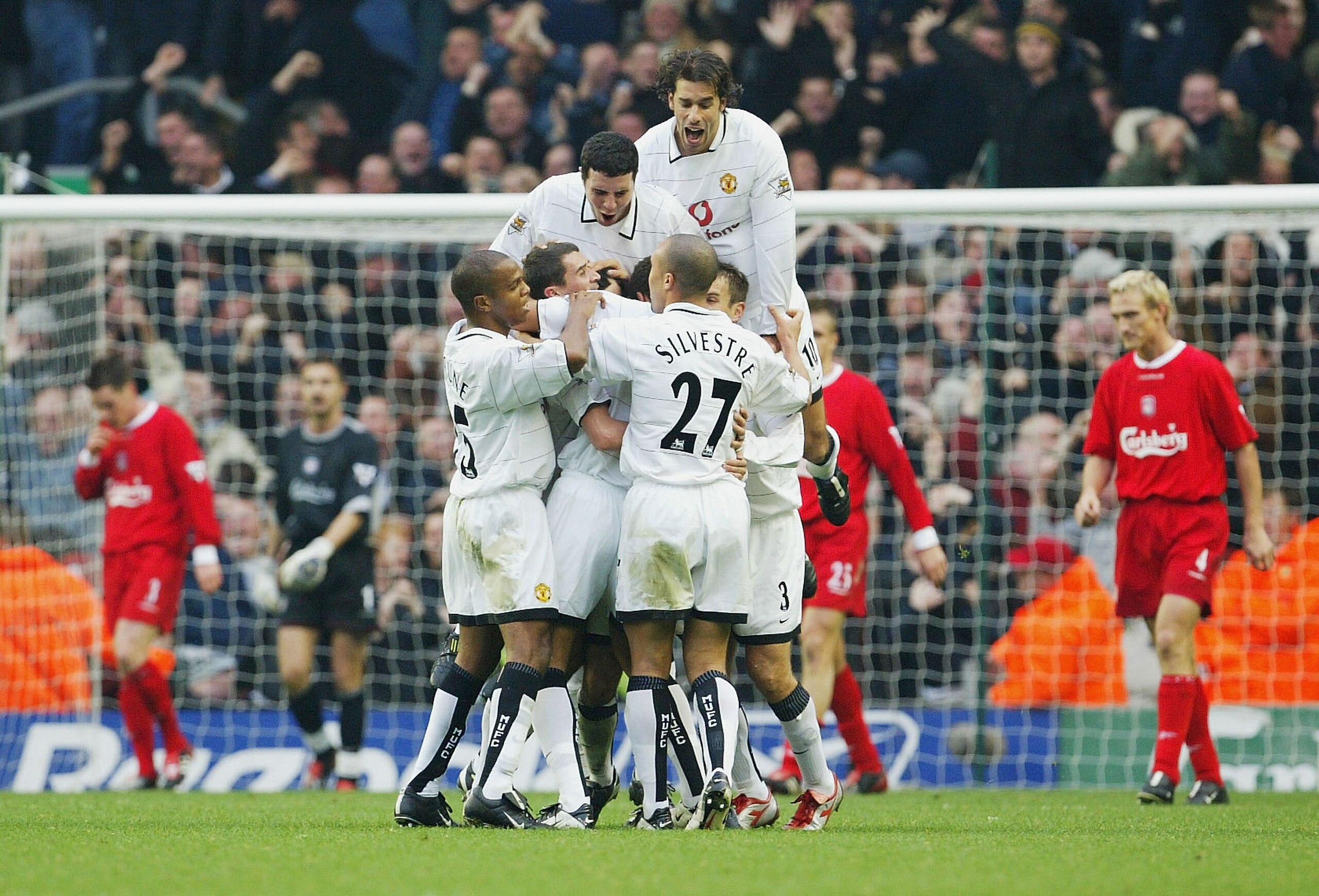 LIVERPOOL, ENGLAND - NOVEMBER 9:  Ryan Giggs of Man Utd is mobbed after scoring the first goal during the FA Barclaycard Premiership match between Liverpool and Manchester United at Anfield stadium on November 9, 2003 in Liverpool, England. (Photo by Laur