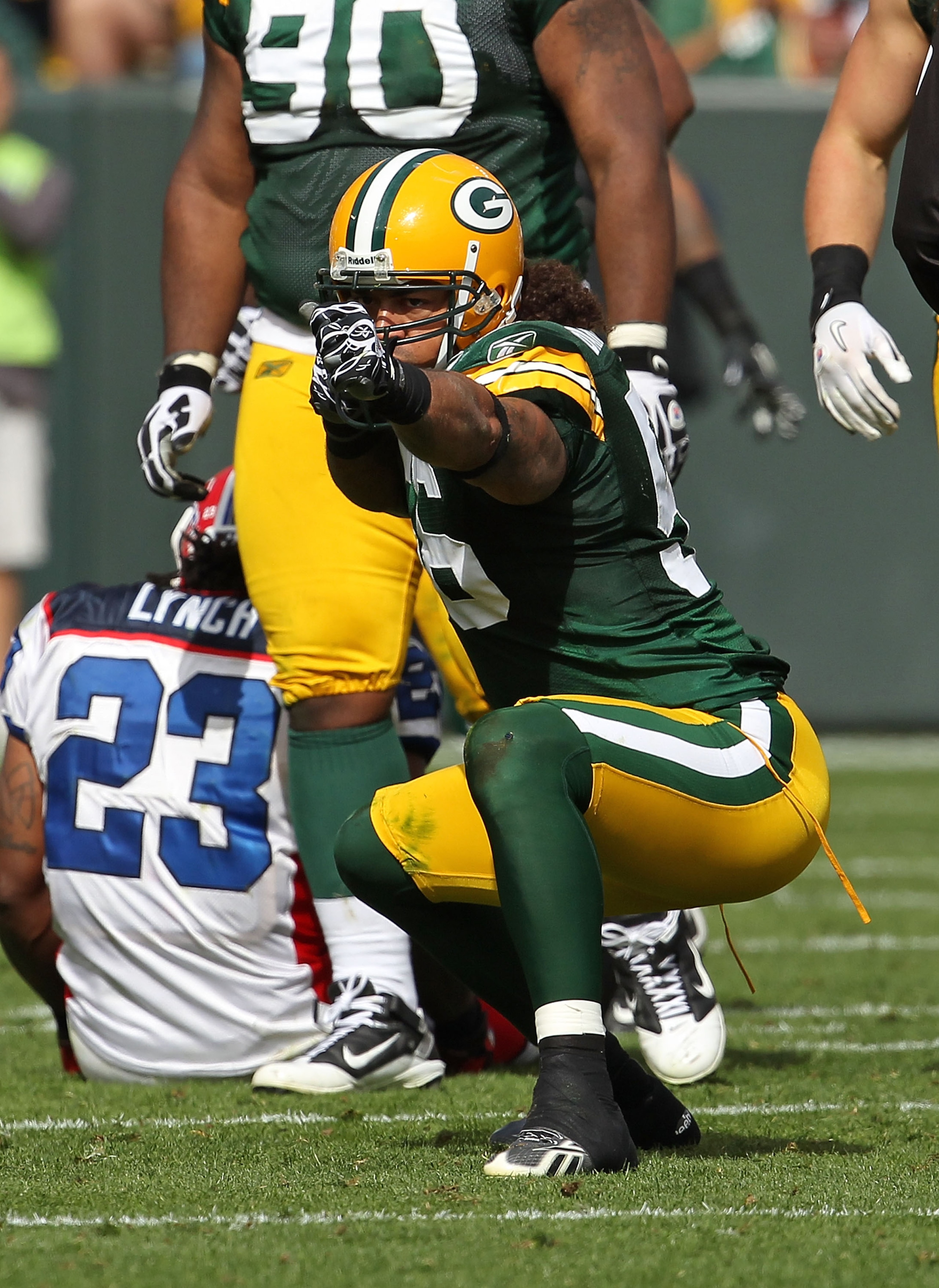 GREEN BAY, WI - SEPTEMBER 19: Nick Barnett #56 of the Green Bay Packers celebrates a defensive stop against Marshawn Lynch #23 of the Buffalo Bills at Lambeau Field on September 19, 2010 in Green Bay, Wisconsin. The Packers defeated the Bills 34-7. (Photo