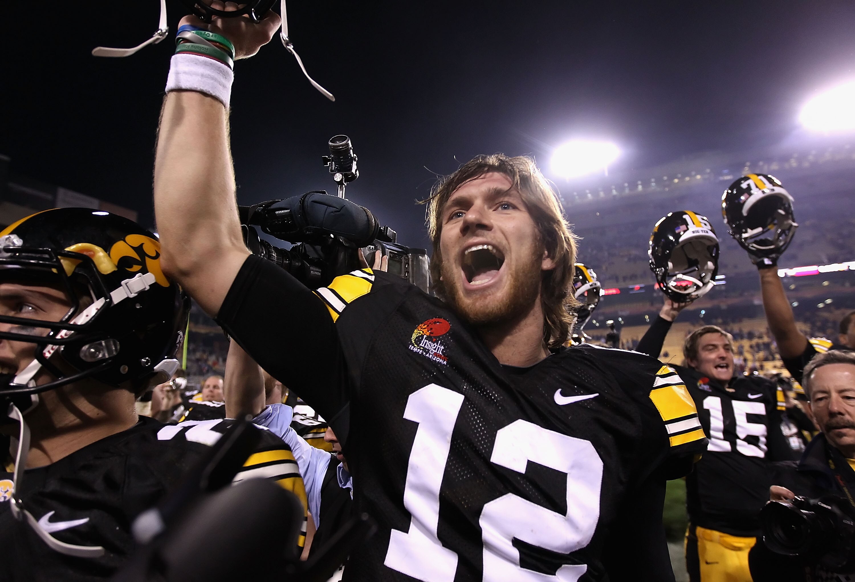 TEMPE, AZ - DECEMBER 28:  Quarterback Ricky Stanzi #12 of the Iowa Hawkeyes celebrates with teammates after defeating the Missouri Tigers in the Insight Bowl at Sun Devil Stadium on December 28, 2010 in Tempe, Arizona. The Hawkeyes defeated the Tigers 27-