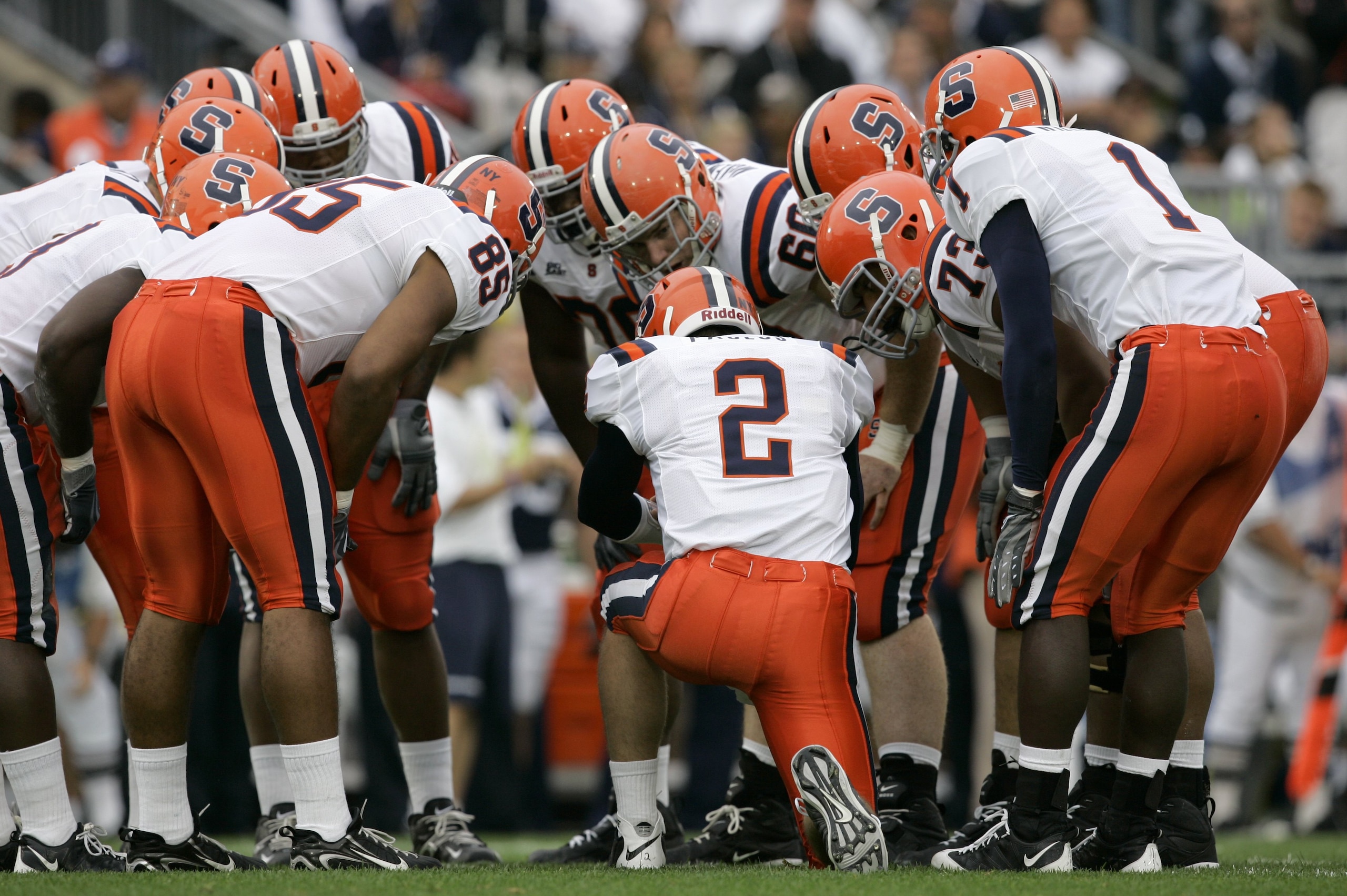 STATE COLLEGE, PA - SEPTEMBER 12: Quarterback Greg Paulus #2 of the Syracuse Orangemen talks to his team in the huddle during the first half against the Penn State Nittany Lions at Beaver Stadium  September 12, 2009 in State College, Pennsylvania. (Photo