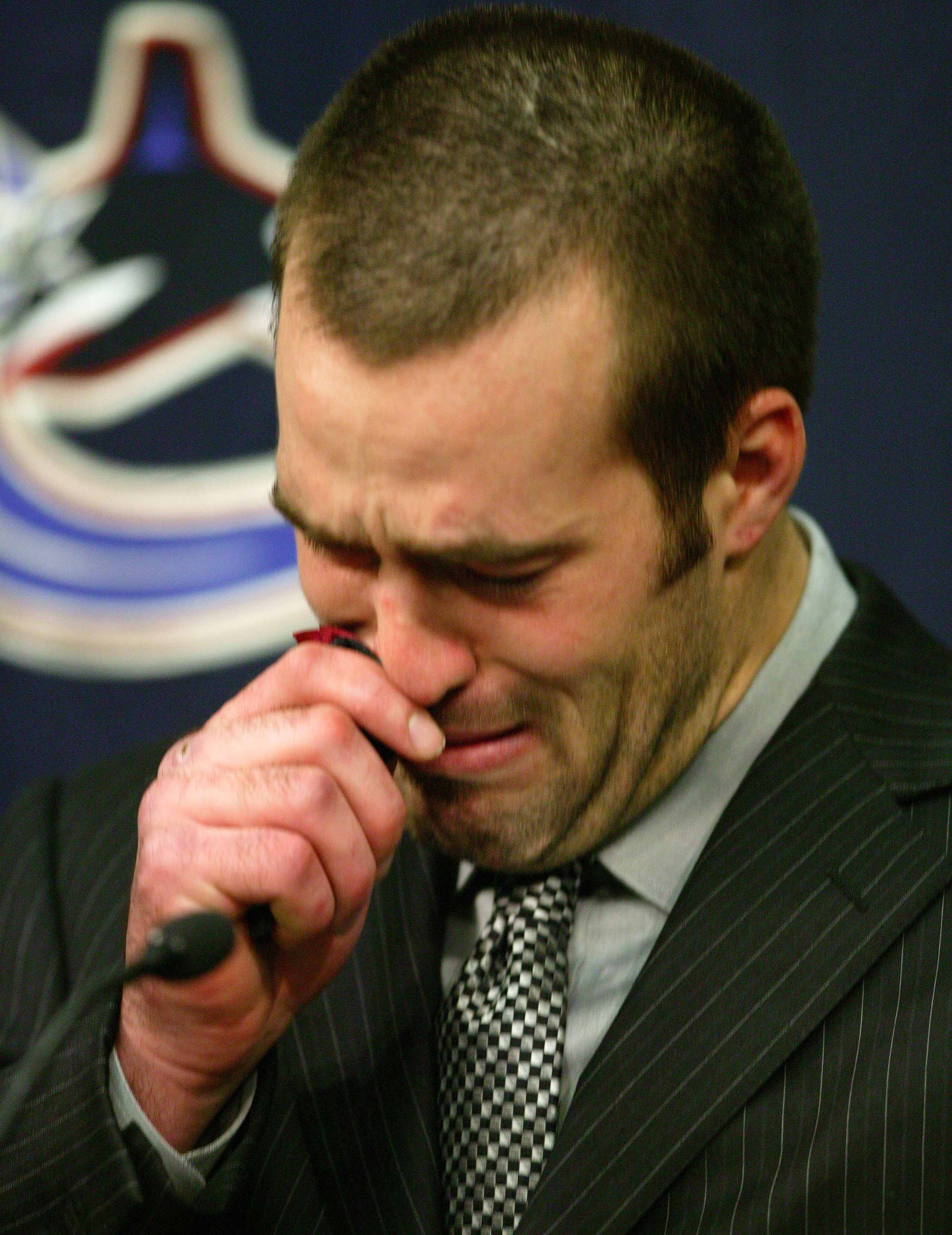 VANCOUVER - MARCH 10: Todd Bertuzzi of the Vancouver Canucks talks to the media prior to start of the the Canuck's NHL game against the Minnesota Wild at General Motors Place on March 10, 2004 in Vancouver, Canada. Bertuzzi faced an NHL disciplinary h VANCOUVER - MARCH 10: Todd Bertuzzi of the Vancouver Canucks talks to the media prior to start of the the Canuck's NHL game against the Minnesota Wild at General Motors Place on March 10, 2004 in Vancouver, Canada. Bertuzzi faced an NHL disciplinary h